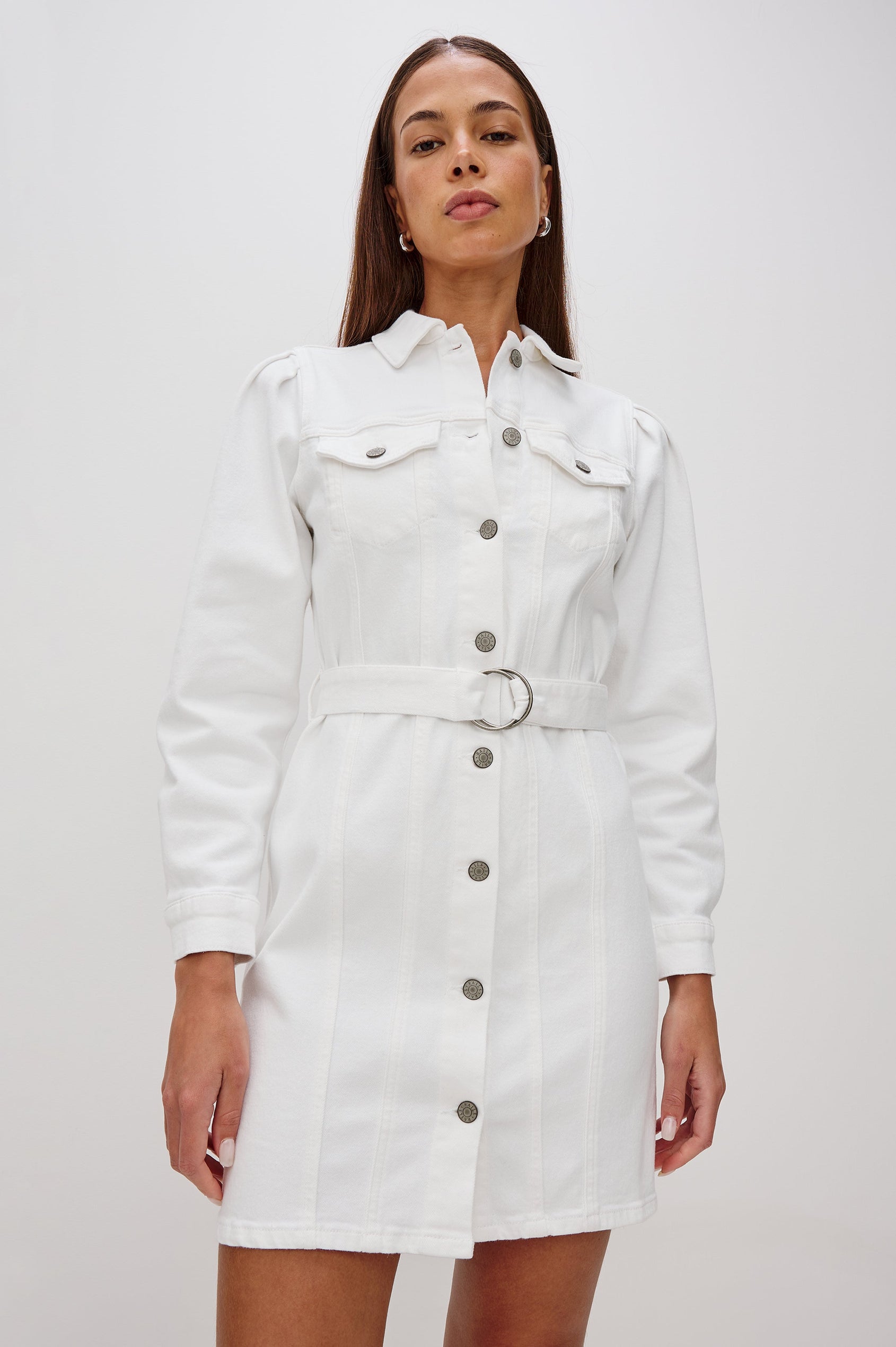 Griffith Denim Shirt Dress with Puff Shoulder Long Sleeves, Self Belt with Metal D-Rings and Chest Flap Pockets in Salt White Colorway. Front View Shown on Model.