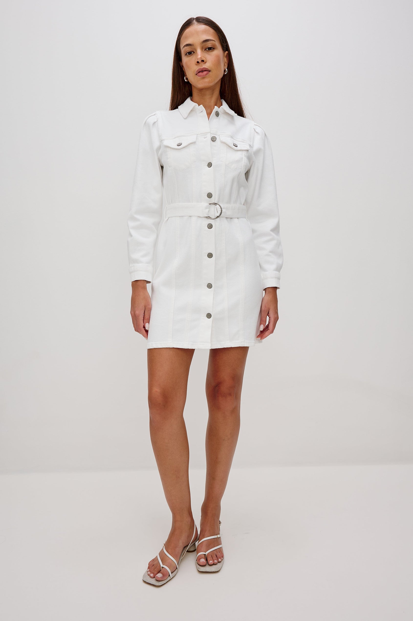 Griffith Denim Shirt Dress with Puff Shoulder Long Sleeves, Self Belt with Metal D-Rings and Chest Flap Pockets in Salt White Colorway. Full Body Front View Shown on Model.