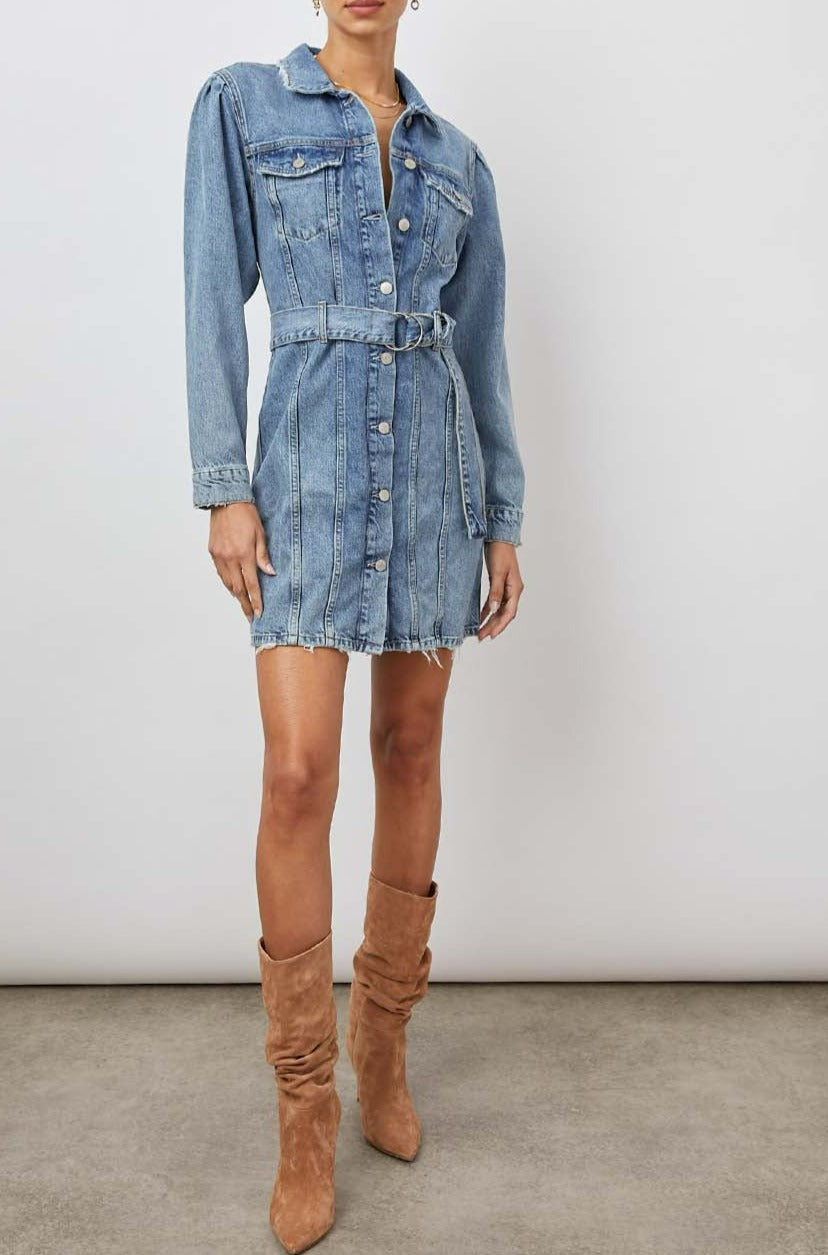 Griffith Long-Sleeve Denim Mini Dress with Buttons Down the Front, a Fabric Double Ring Belt, Two Chest Button Flap Pockets, Frayed Trim and Vertical Seams Down the Front in Indigo Charm Colorway - Front Full Body View Featured on Model 