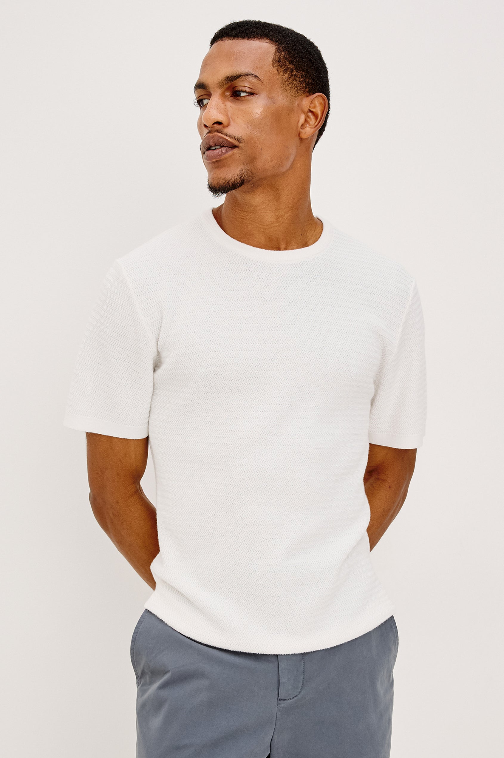 Theo T-Shirt in Ribbed Cotton-Cashmere With Crew Neckline, Short Sleeves, and Classic Fit in Porcelain Colorway - Upper Body Front View Featured on Model