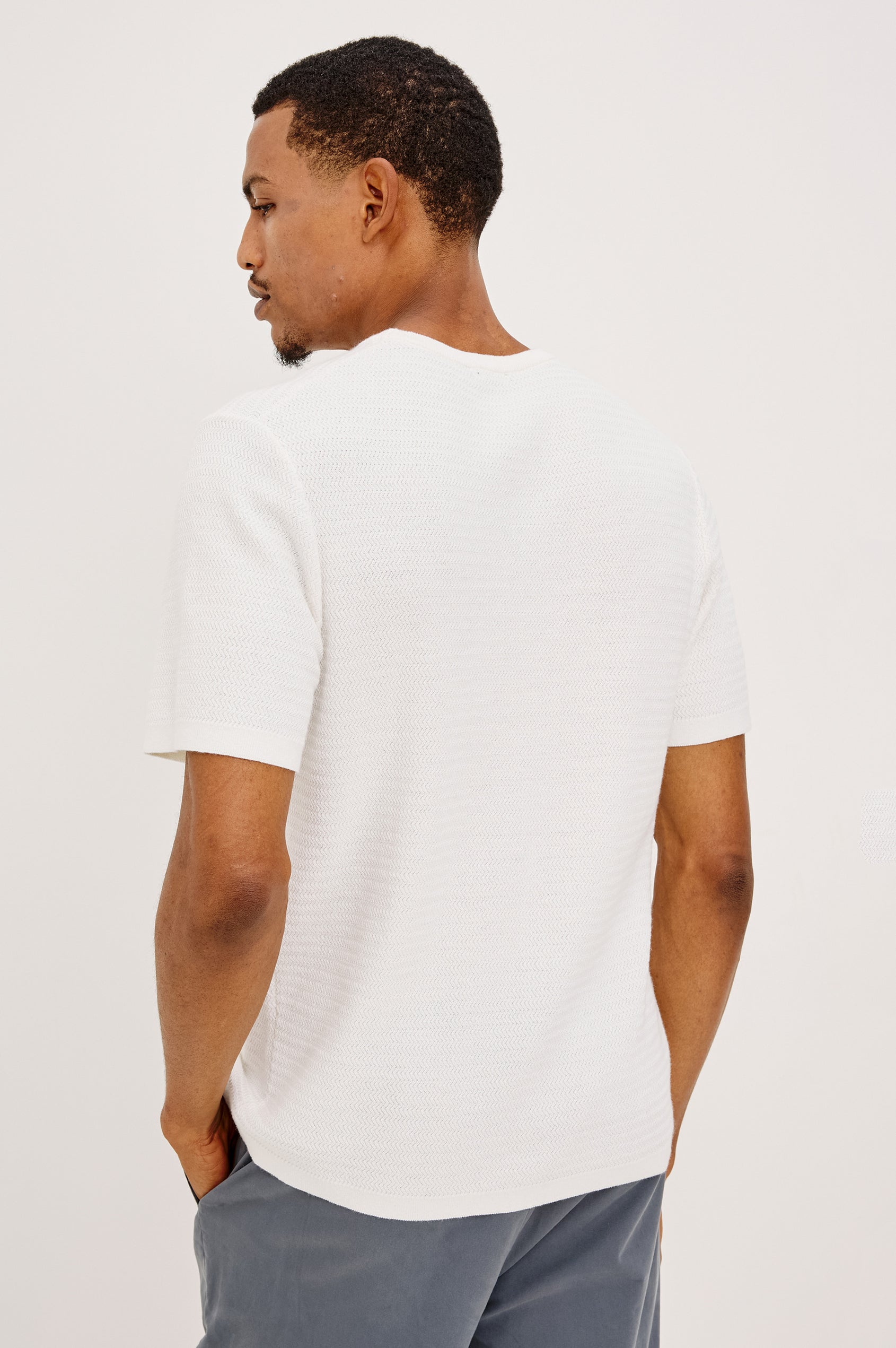 Theo T-Shirt in Ribbed Cotton-Cashmere With Crew Neckline, Short Sleeves, and Classic Fit in Porcelain Colorway - Upper Body Back View Featured on Model