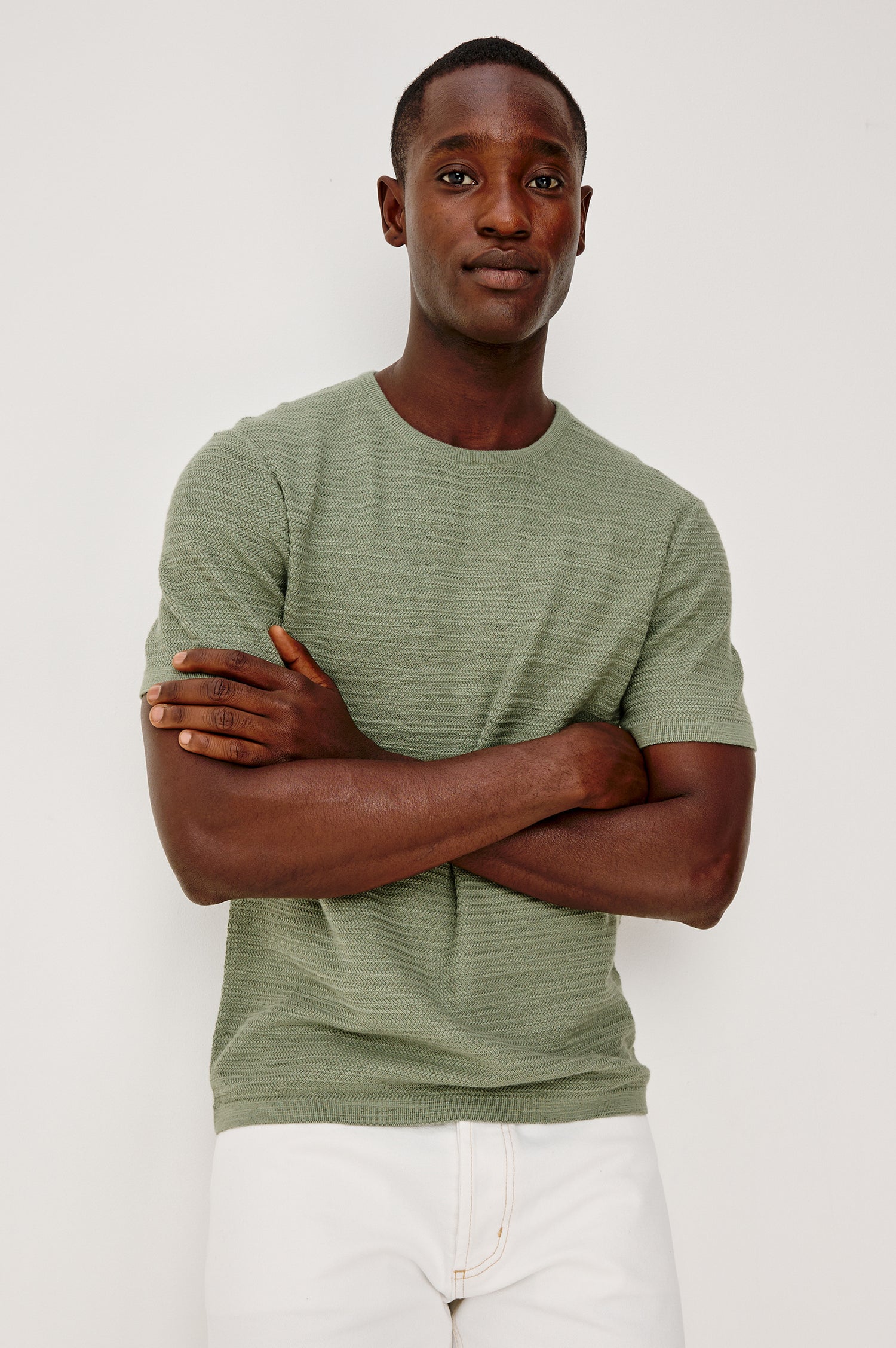 Nathan Polo Shirt in Cotton Blend Knit With Collar, Quarter Button Placket, and Short Sleeves in Silver Sage Colorway - Upper Body Front View Featured on Model