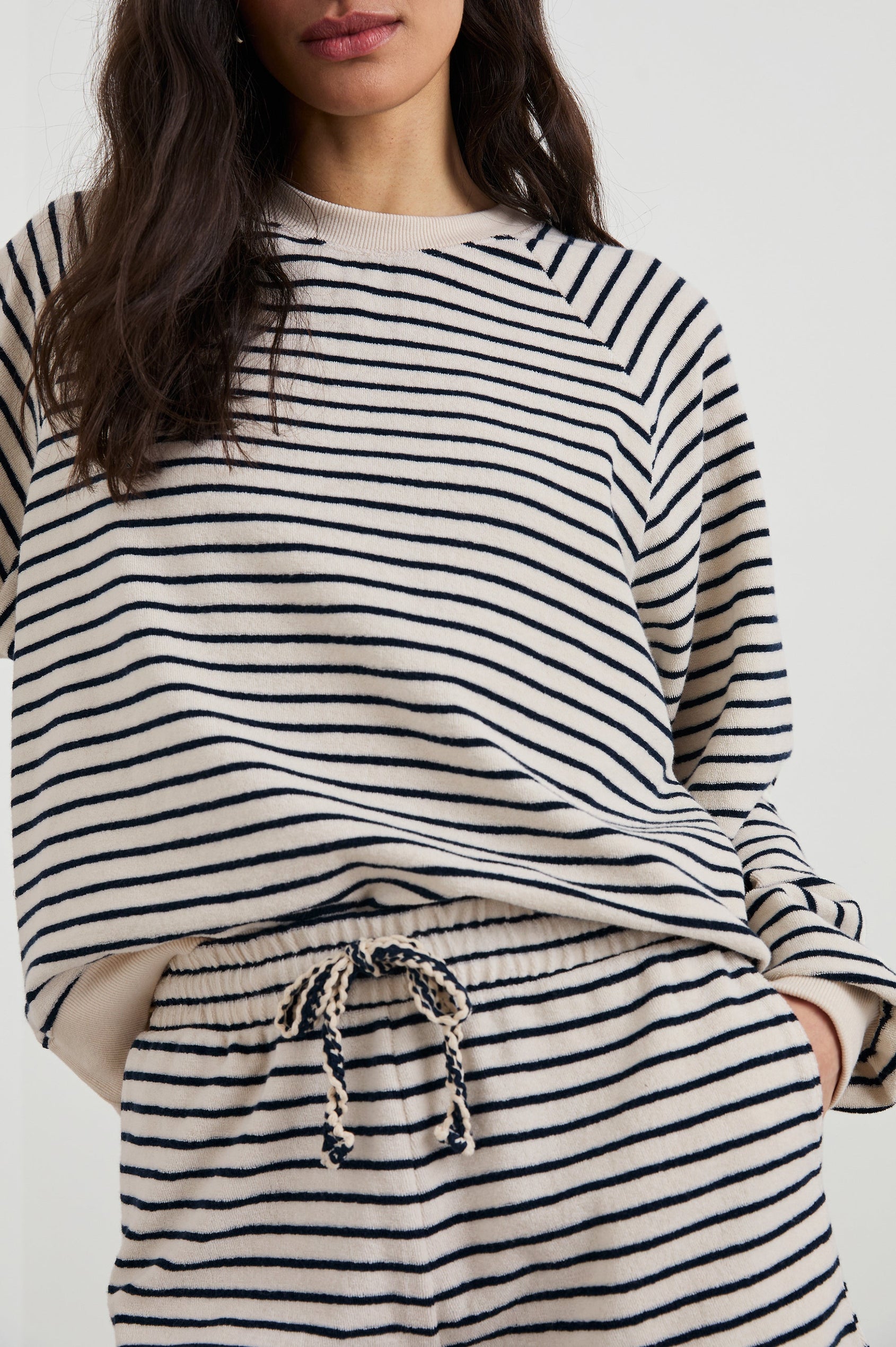 Theron Long-Sleeve Sweatshirt with a Crew Neck in Sailor Stripe Terry Towel Colorway, Navy and Cream Horizontal Stripes - Front View Featured on Model