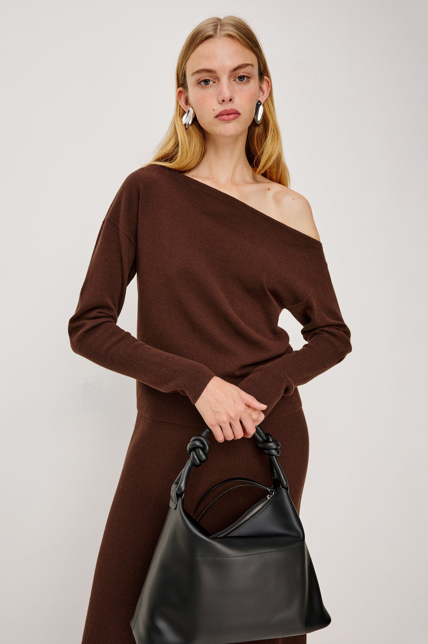 Odita High-Waisted A-lIne Midi Skirt in Wool Blend in Bordeaux Colorway - Upper Body Front View Featured on Model