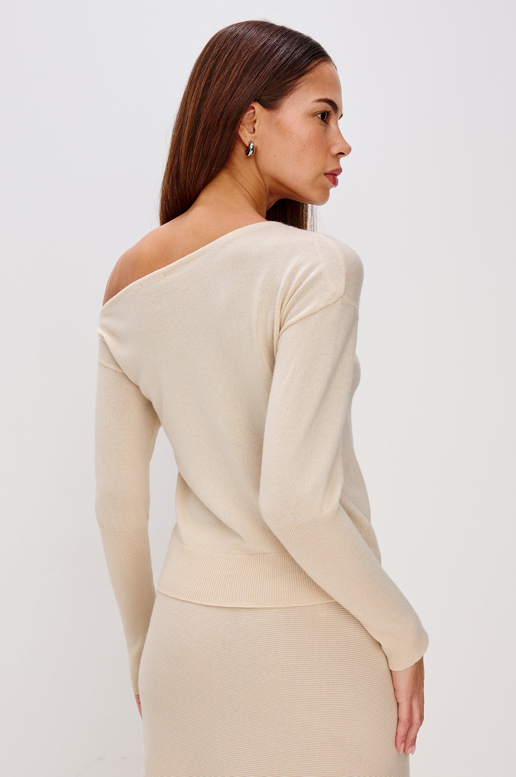 Tianna Off-Shoulder Sweater in Wool Blend With Dropped Shoulders, Long Sleeves, and Ribbed Trim in Ivory Colorway - Upper Body Back View Featured on Model