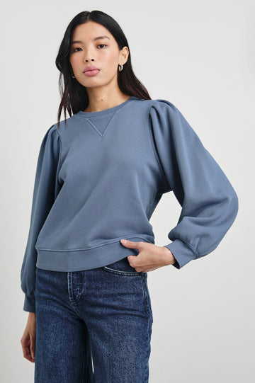 Tiffany Long-Sleeve Sweatshirt with a Crew Neck and Deep Pleated Sleeves in Faded Periwinkle Colorway - Front View Featured on Model