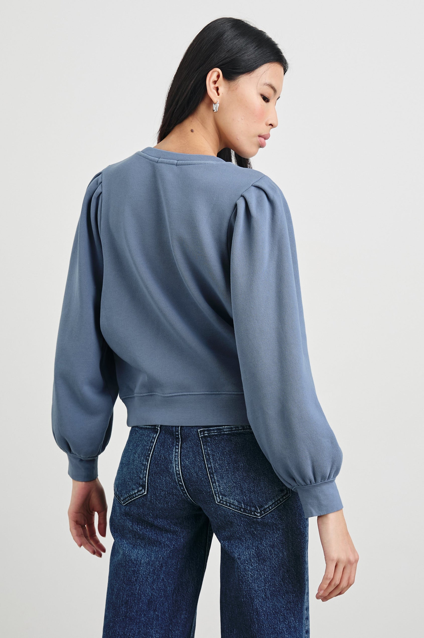 Tiffany Long-Sleeve Sweatshirt with a Crew Neck and Deep Pleated Sleeves in Faded Periwinkle Colorway - Back View Featured on Model