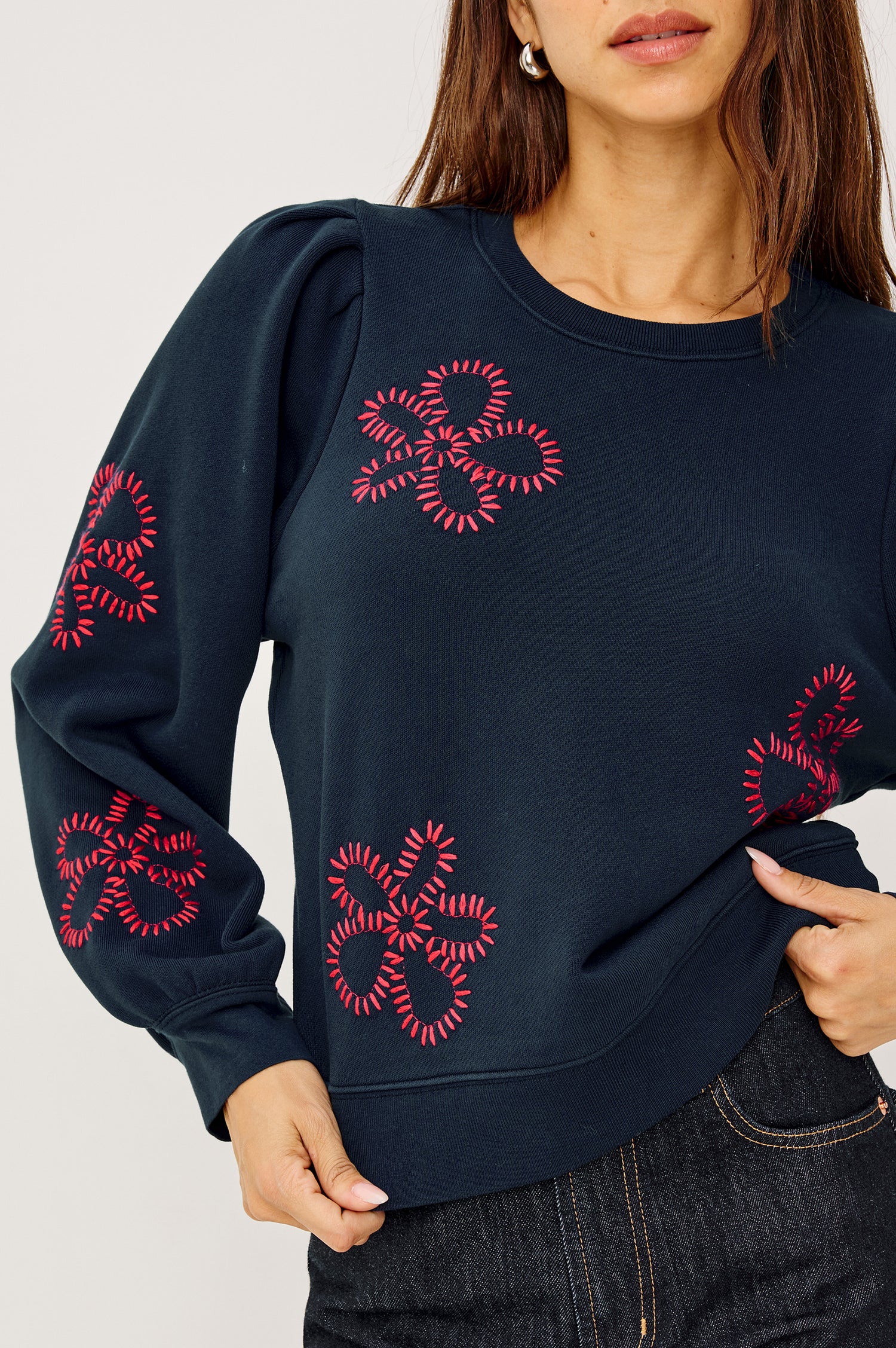 Tiffany Crewneck Sweatshirt in French Terry With Contrast Stitch Floral Motif Pattern, Long Puff Sleeves With Fitted Cuffs, and Ribbed Trim in Navy Colorway - Upper Body Front Close Up View Featured on Model