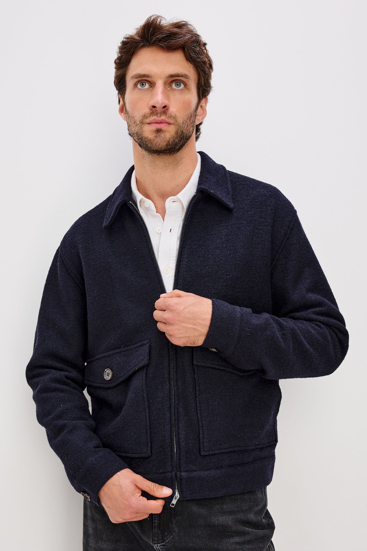 Tillman Front Zip Jacket With Collar, Buttoned Pockets With Top and Side Entry, and Long Sleeves in Navy Boucle Colorway - Upper Body Front View Featured on Model