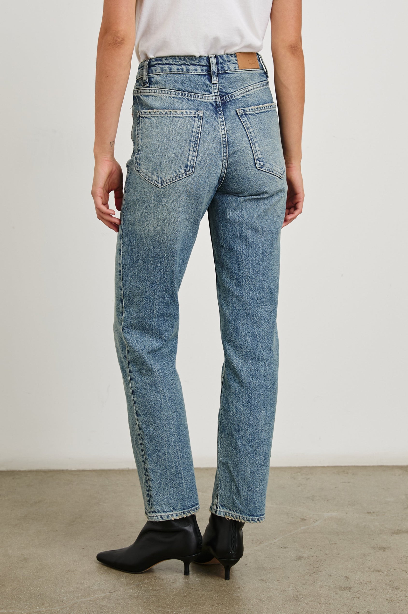 Topanga Straight Jeans with Belt Loops, Two Front Pockets plus a Coin Pocket and Two Back Patch Pockets in Desert Sky Colorway - Back View Featured on Model