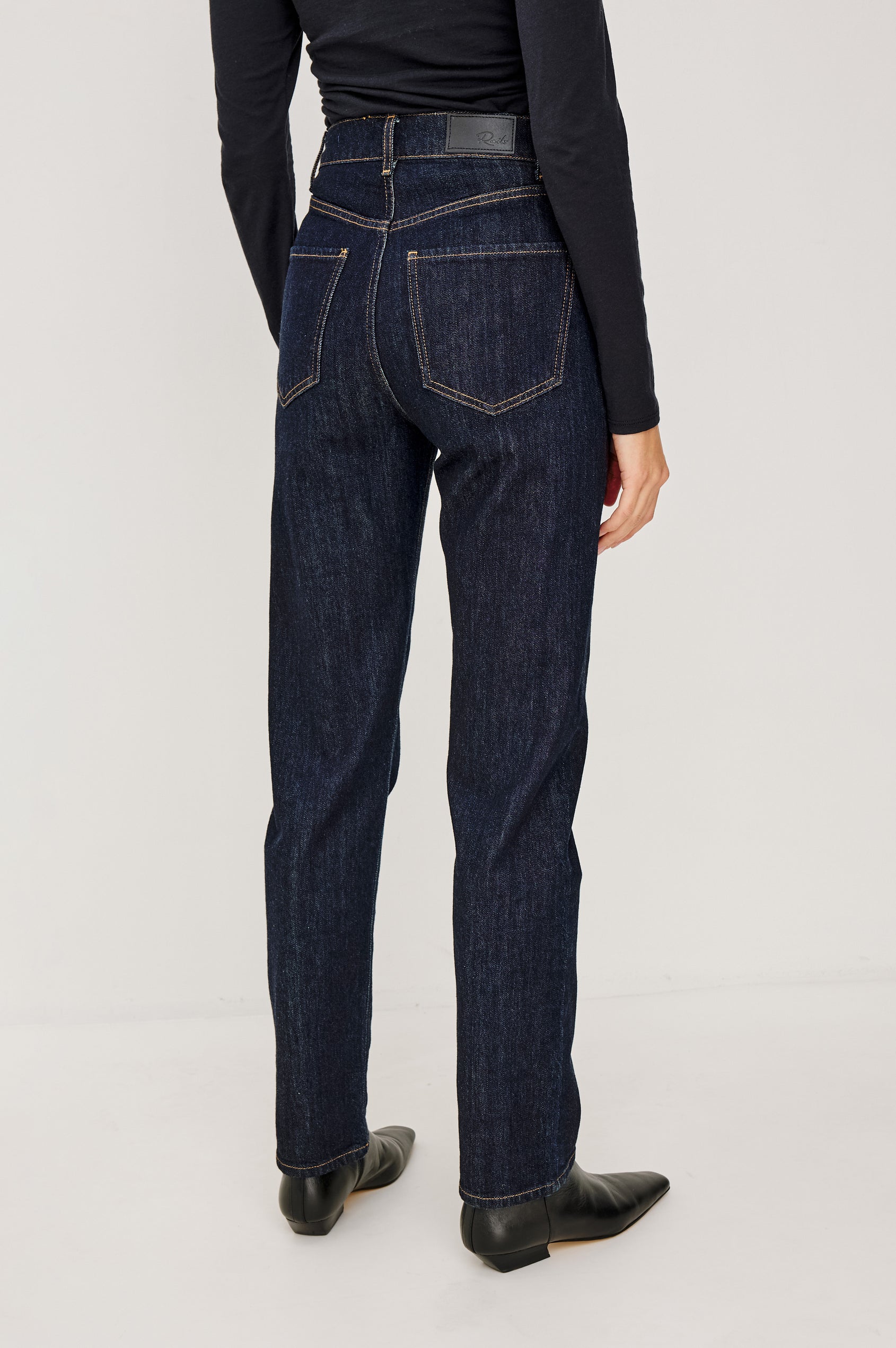 Del Mar Low-Rise Wide Straight Leg Jean in Rigid Dark Wash Denim With Wide Straight Legs, Saddle Seam Detailing, in Onyx Colorway - Lower Body Back View Featured on Model