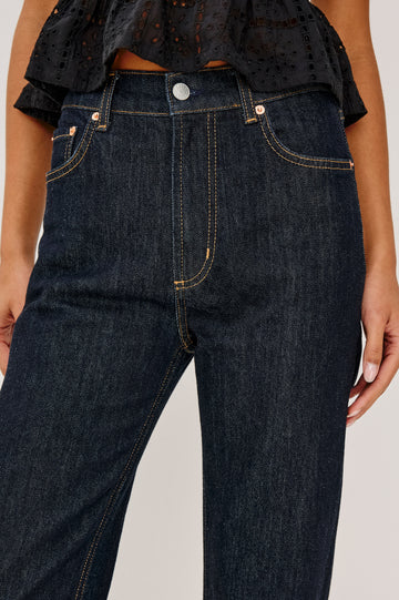 Topanga High-Rise Wide Straight Leg Jean in Dark Wash Denim With 5-Pockets and a Front Zip-Fly in Midnight Blues Colorway - Close up Front View Featured on Model