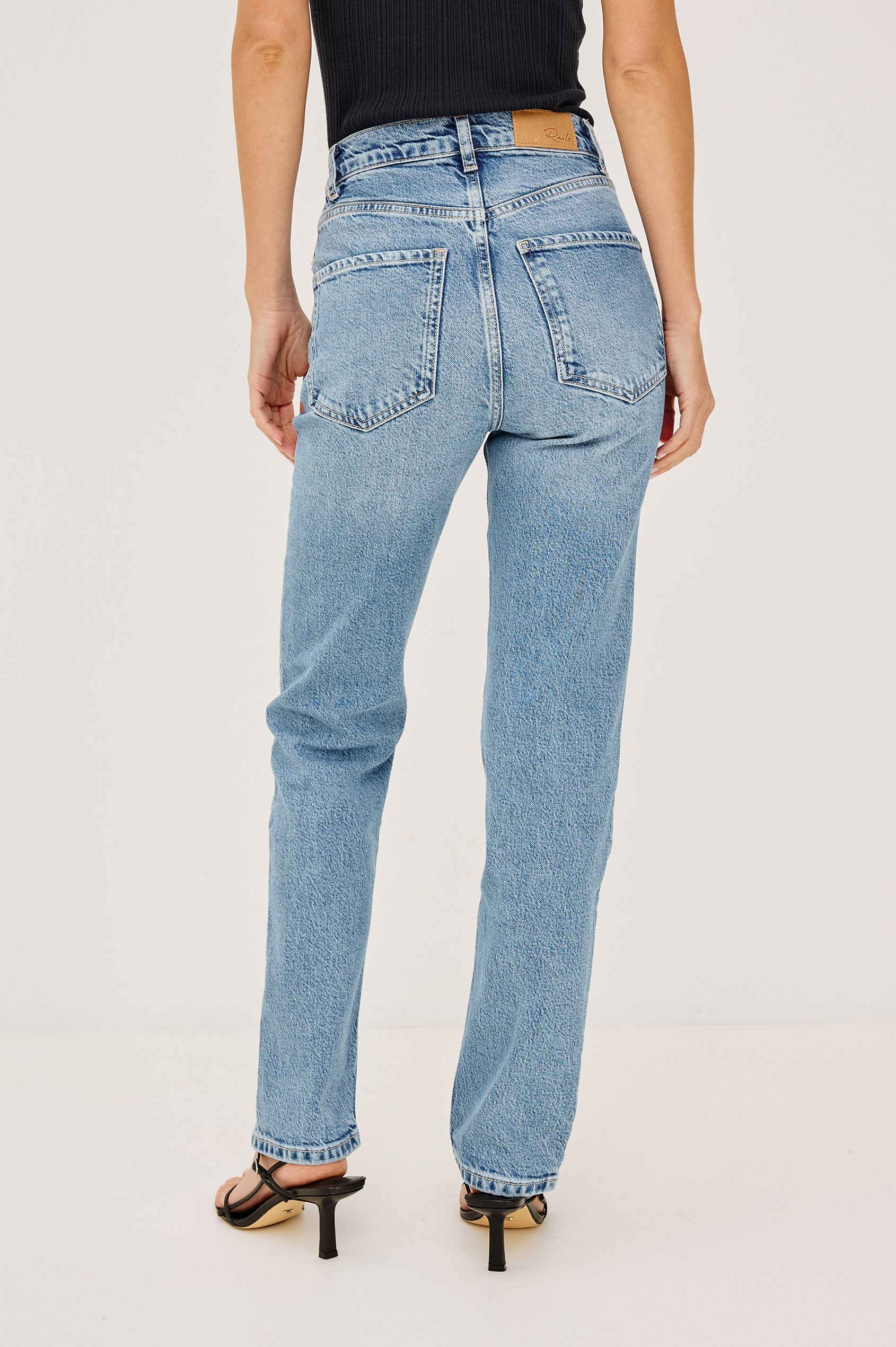 Topanga Petite High-Rise Wide Straight Leg Jean in With 5-Pockets and a Front Zip-Fly in Old Indigo Colorway - Front View Featured on Model