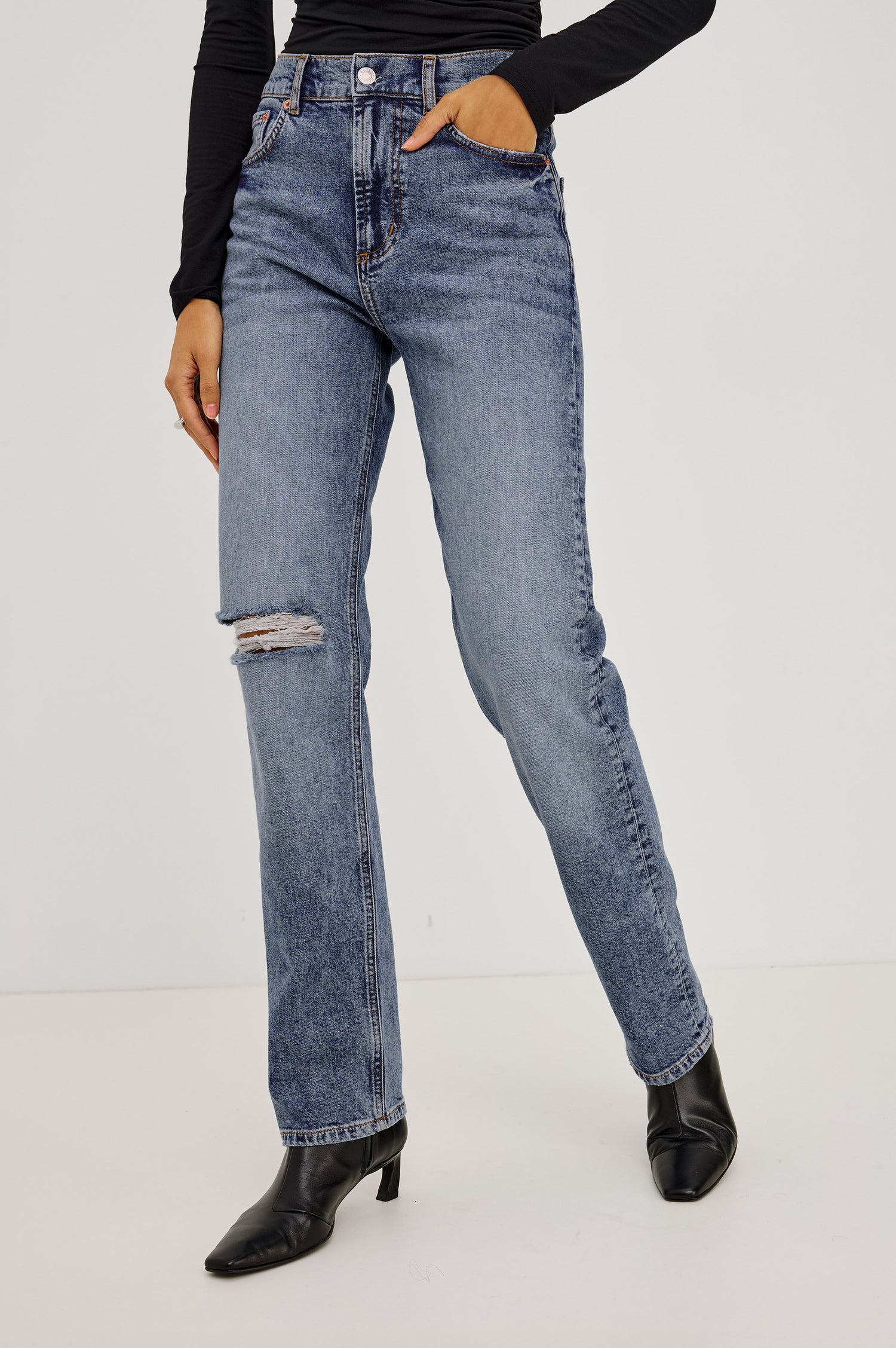 Petite Topanga Straight Jean in Comfort-Stretch Denim With High-Rise, Distressed Knee, 5-Pockets, and Zipper Fly in Rancher Deconstructed Colorway - Lower Body Front View Featured on Model