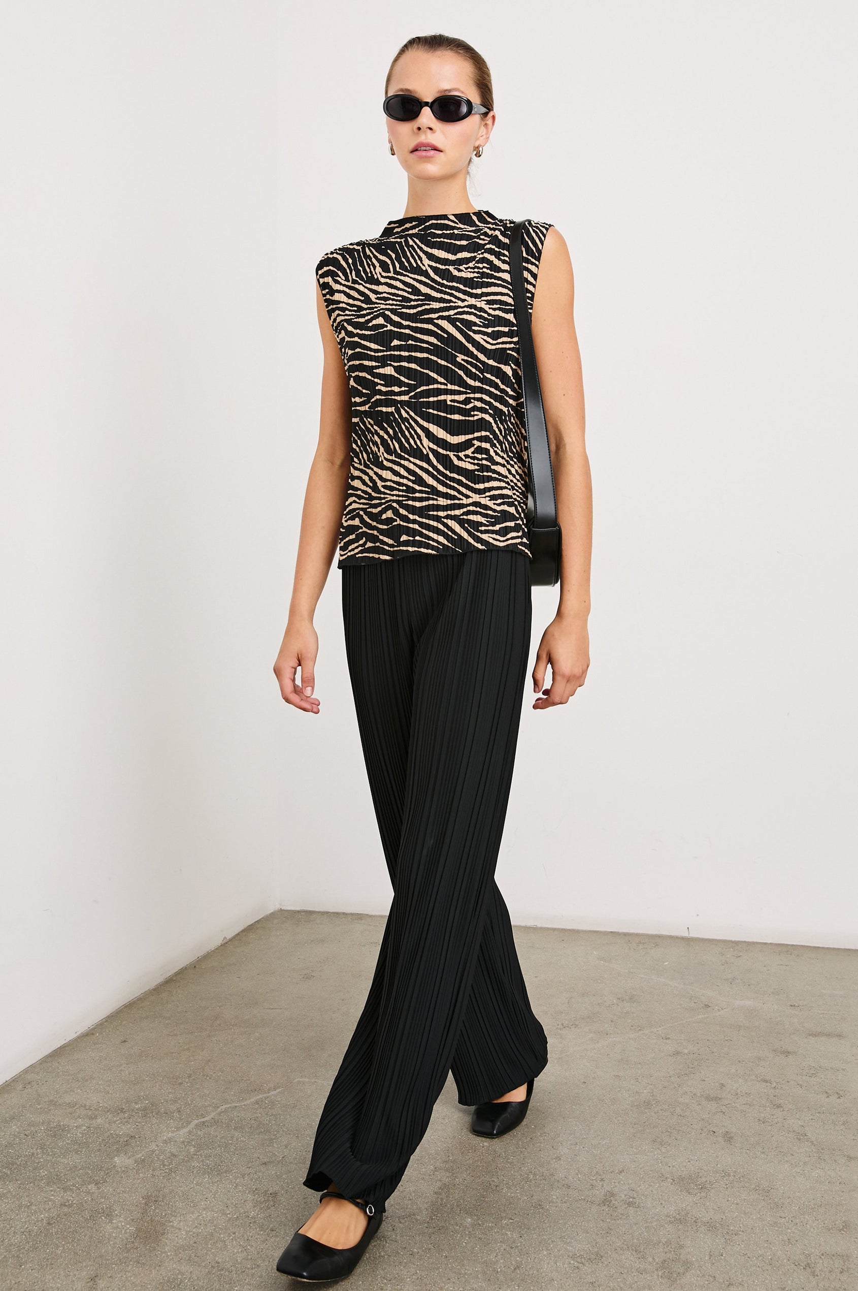Trea Sleeveless Top with a Mock Neck and Pleated Texture in Cairo Colorway, a Black and Tan Tiger Stripe - Front Full Body View Featured on Model