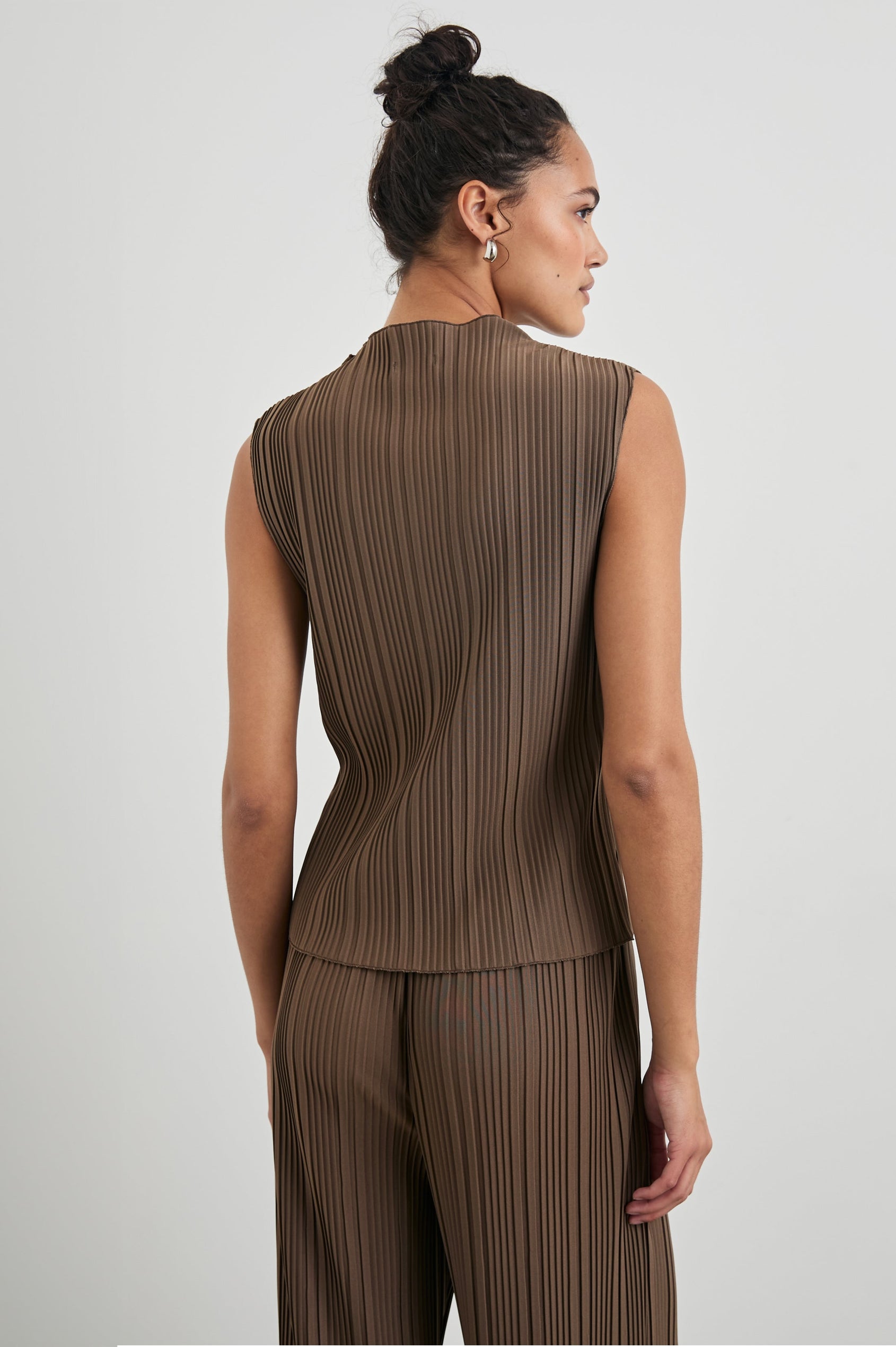 Trea Sleeveless Top with a Mock Neck and Pleated Texture in Morel Colorway - Back View Featured on Model
