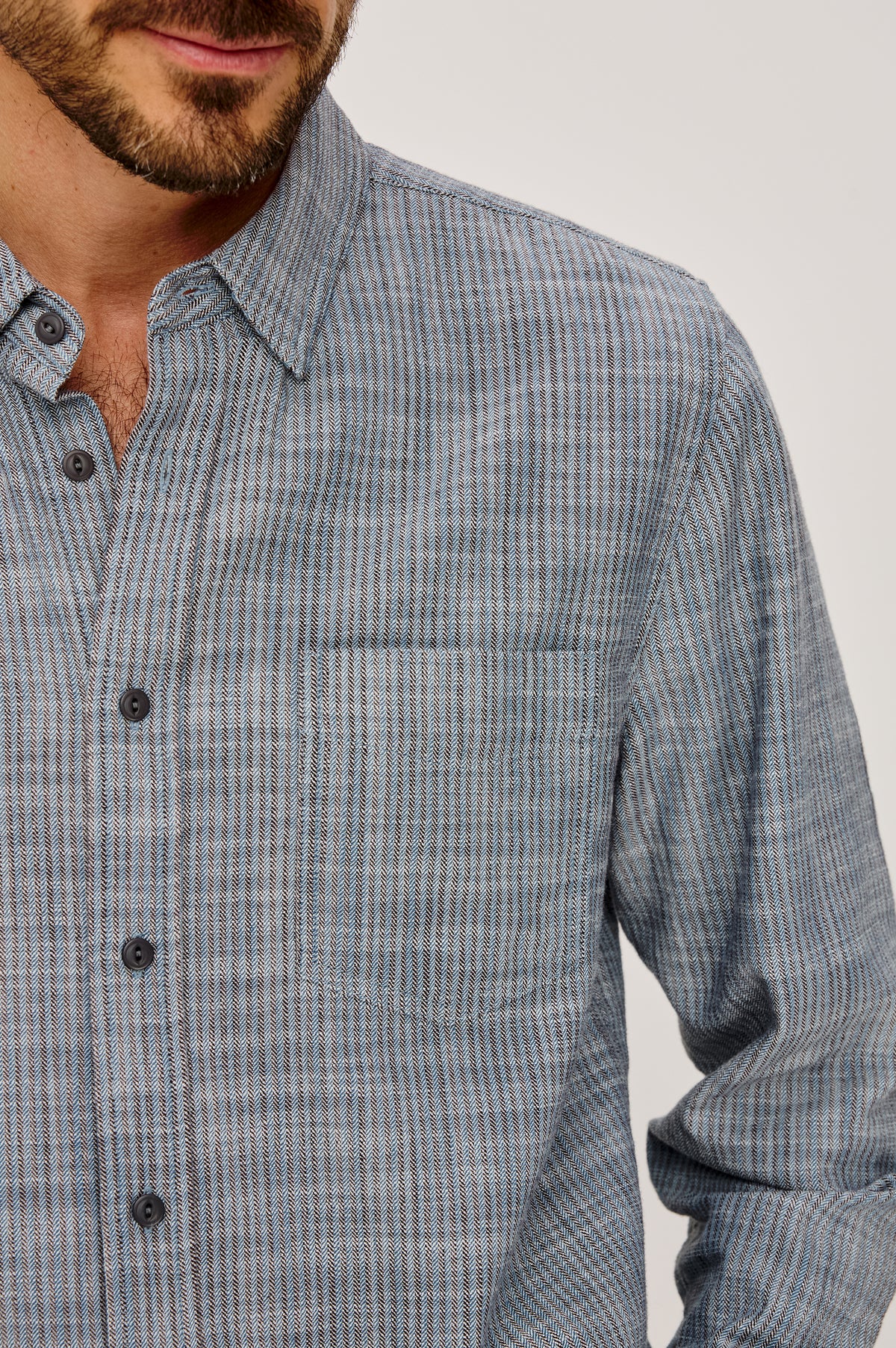 Tristan Shirt in 100% Cotton With Rope-Dyed Washed Effect, Collar, Chest Patch Pocket, Front Button Closure, and Long Sleeves in Marine Kelp Stripe Colorway - Upper Body Front Close Up View Featured on Model