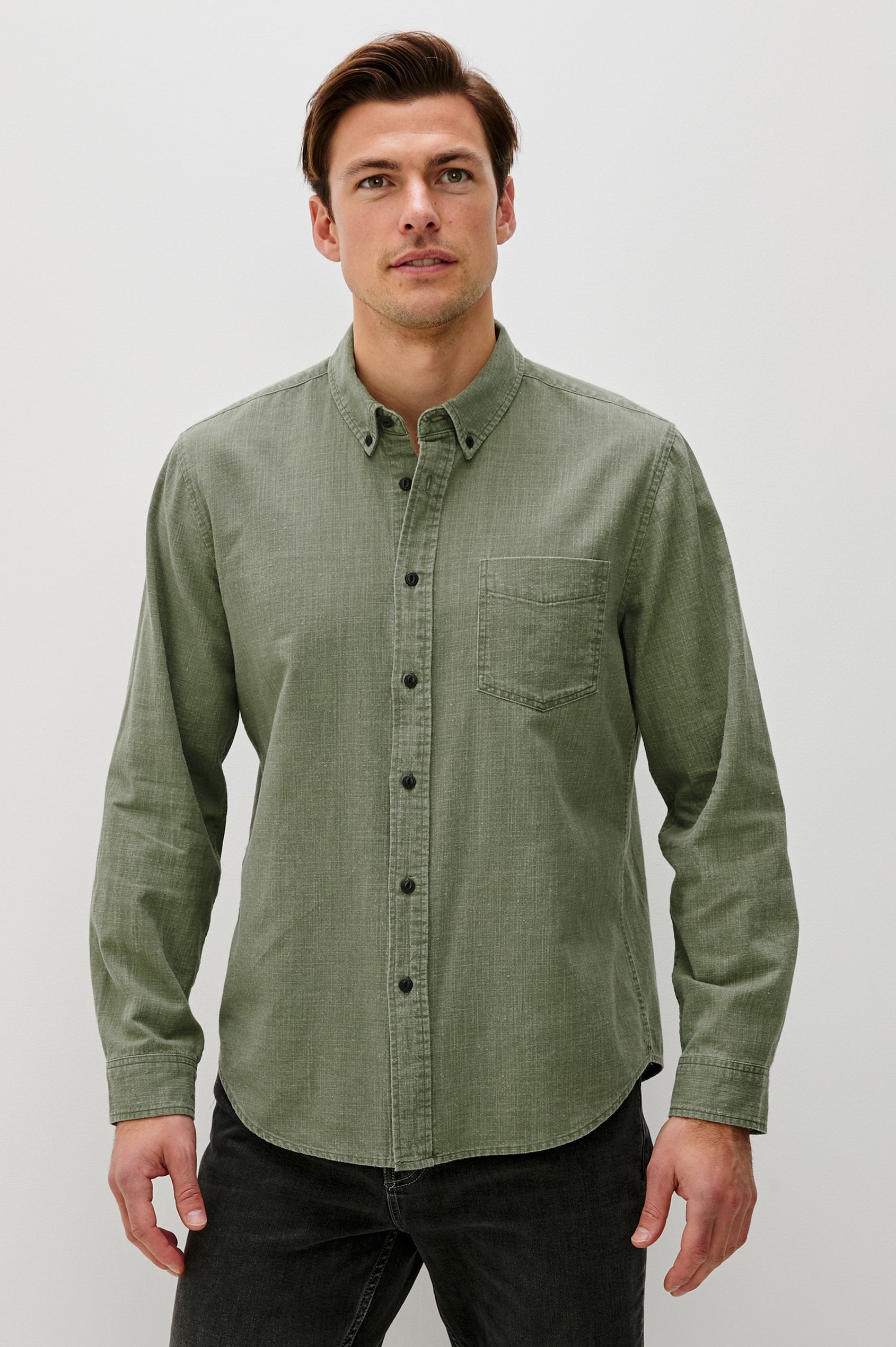 Tristan Long-Sleeve Button Down with a Chest Patch Pocket in Surplus Colorway, a olive green  - Front View Featured on Model