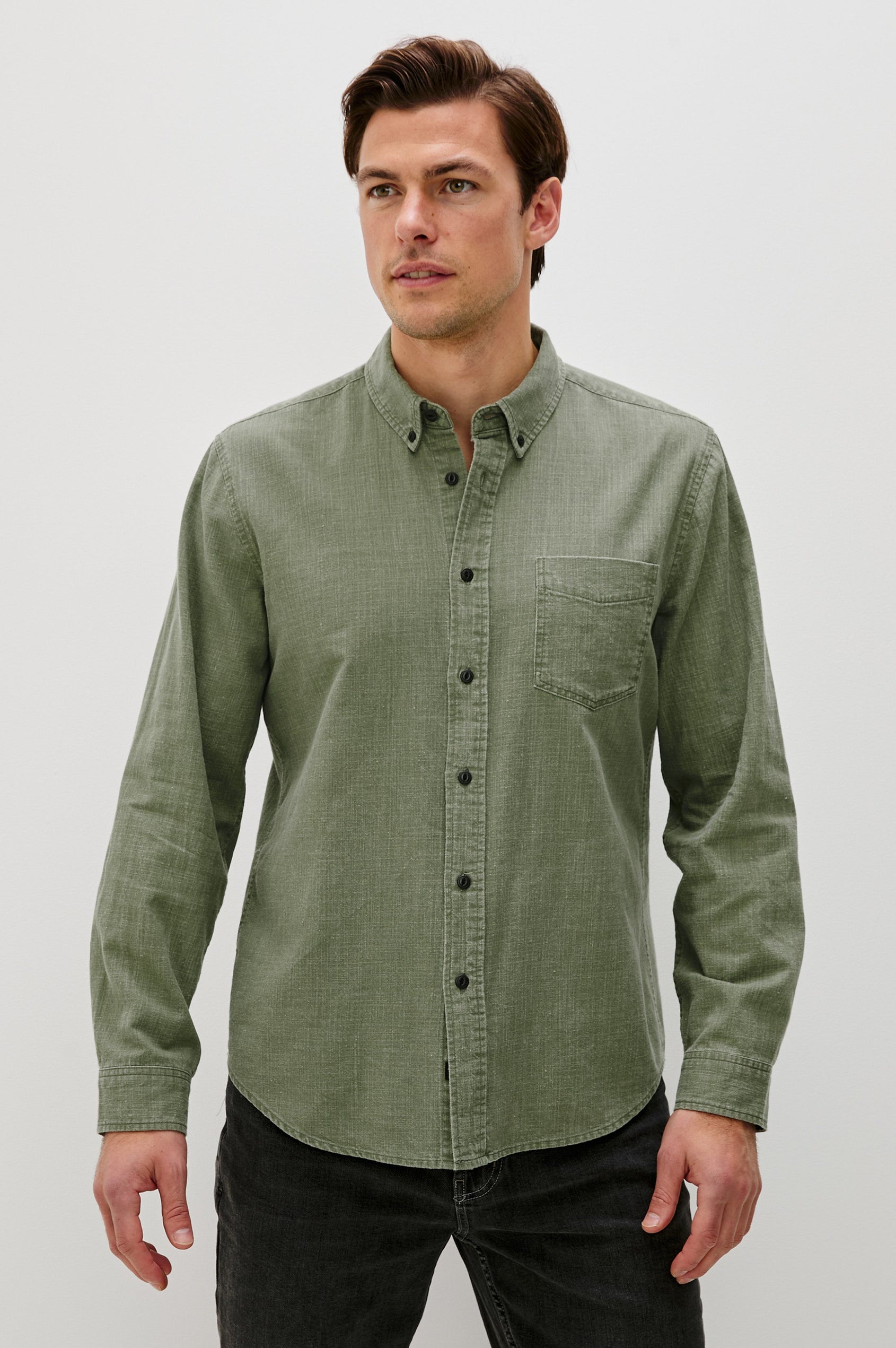Tristan Long-Sleeve Button Down with a Chest Patch Pocket in Surplus Colorway, a olive green  - Front View Featured on Model