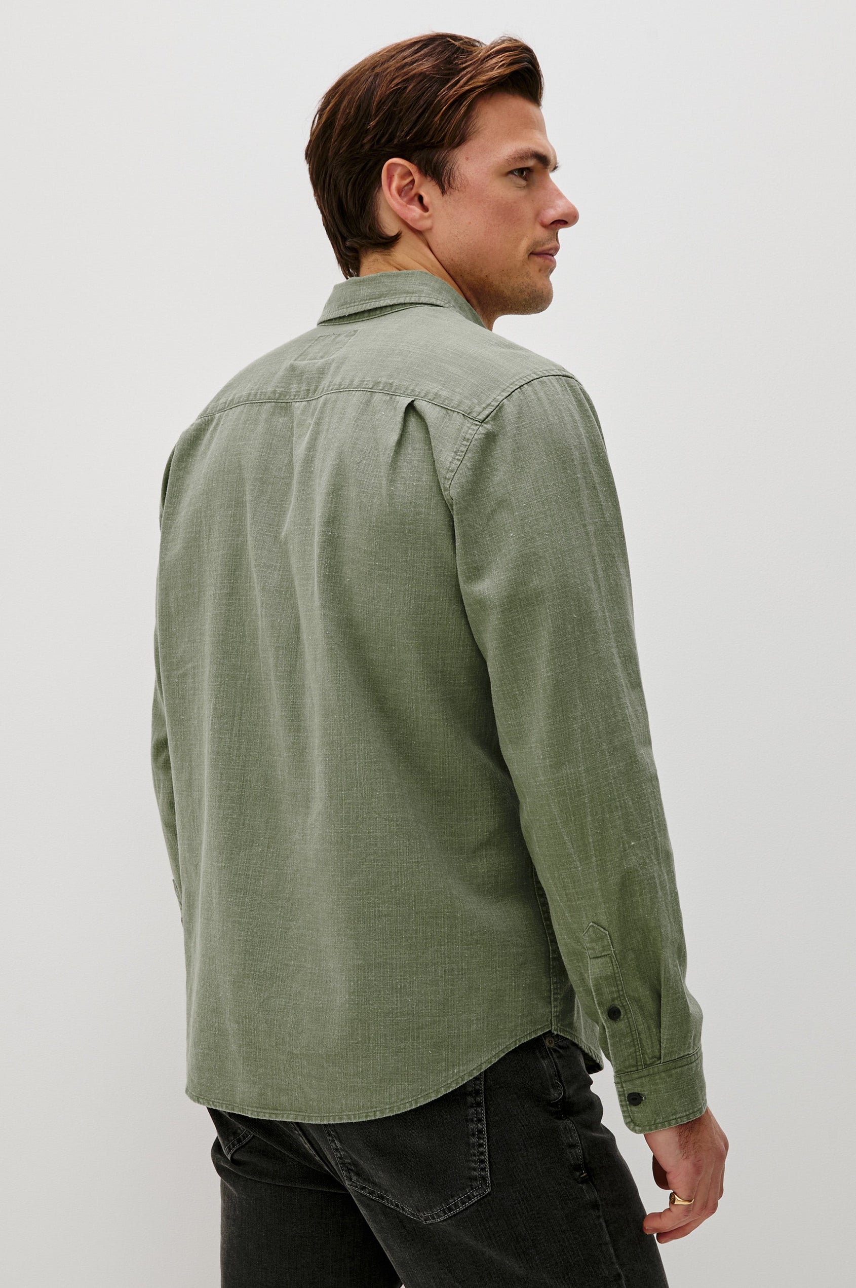 Tristan Long-Sleeve Button Down with a Chest Patch Pocket in Surplus Colorway, a olive green  - Back View Featured on Model