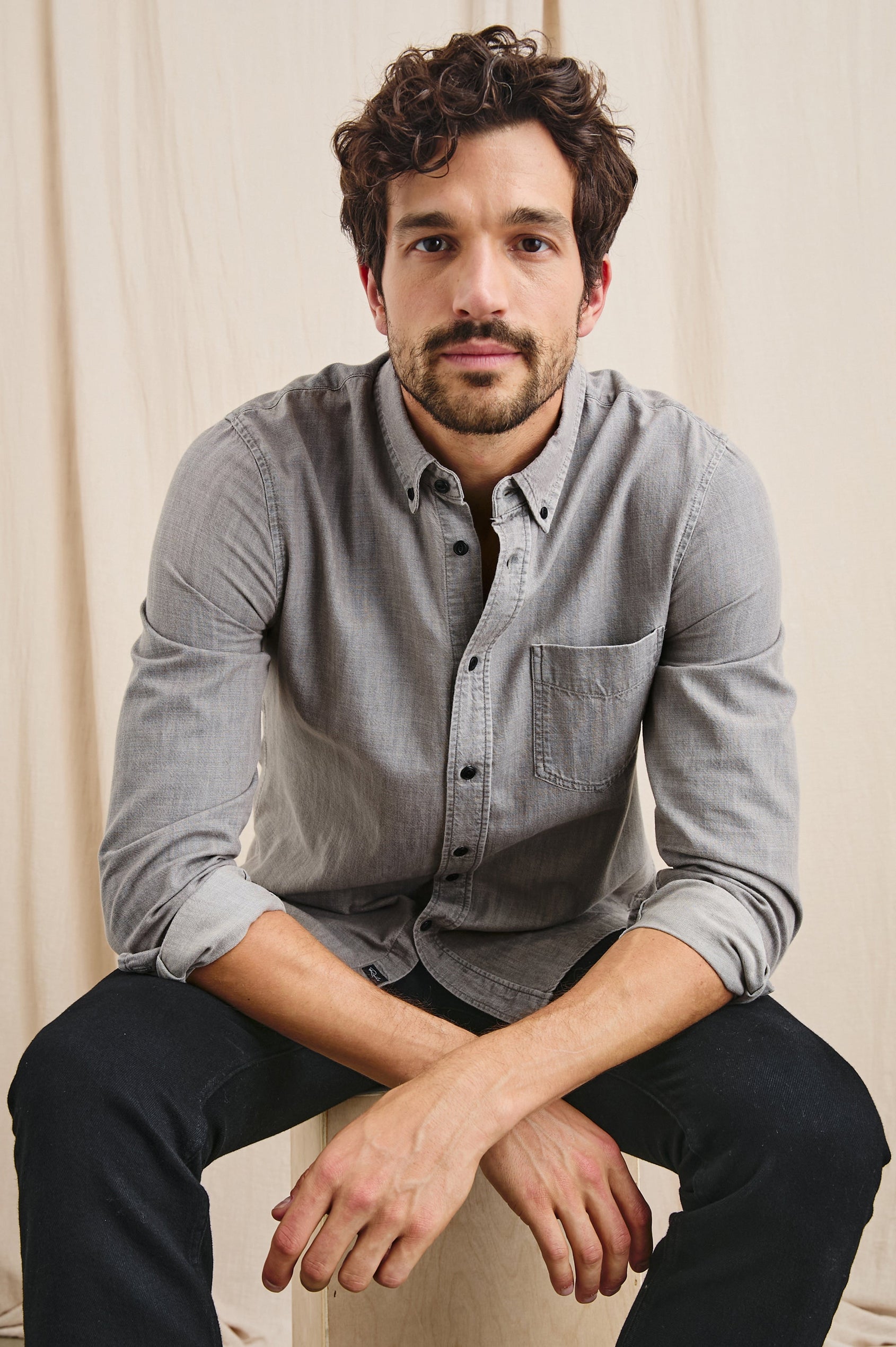 Tristan Long-Sleeve Button Down with a Chest Patch Pocket in Trail Mix Colorway, a brownish grey - Front Full Body View Featured on Seated Model