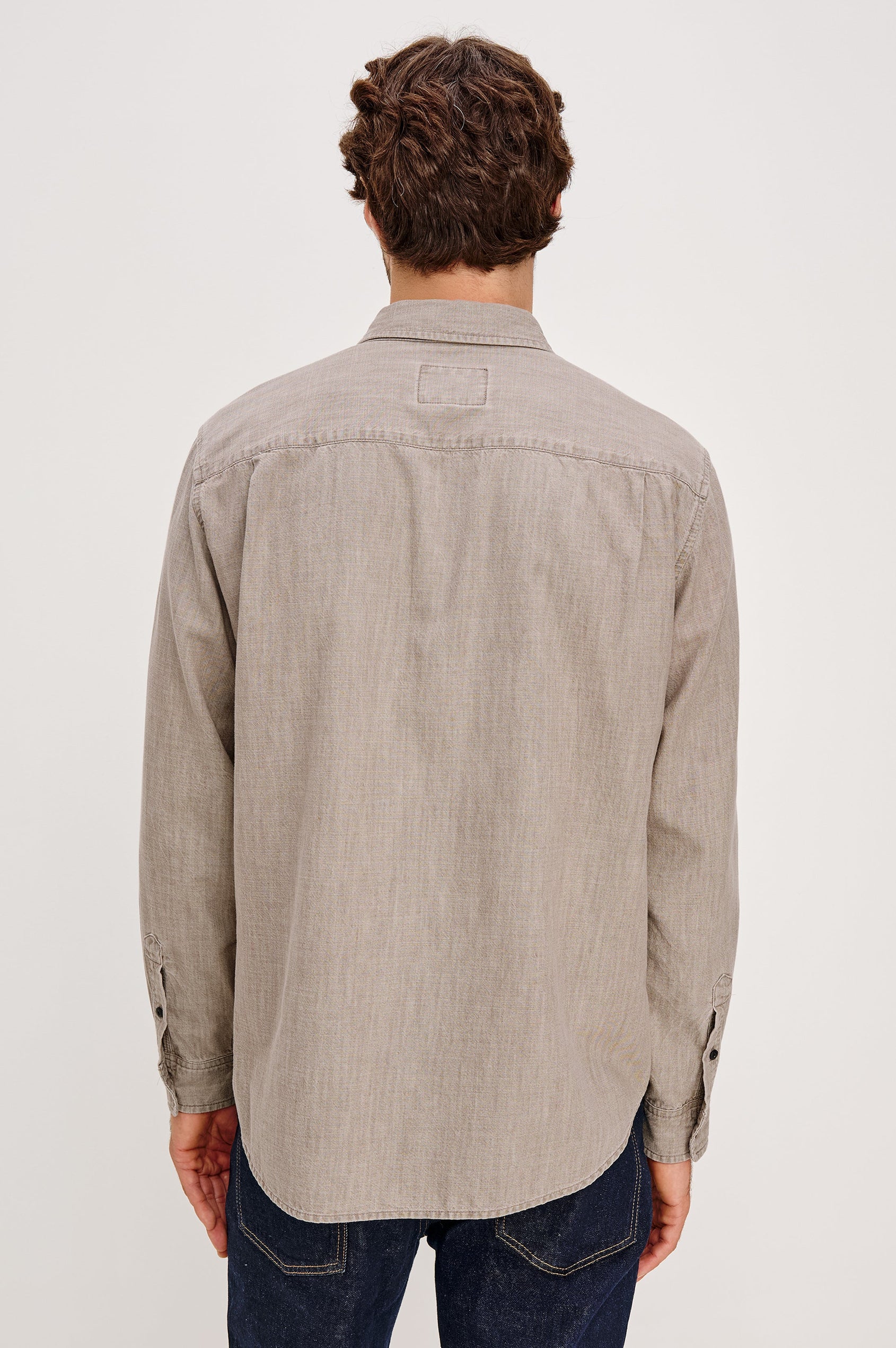 Tristan Long-Sleeve Button Down with a Chest Patch Pocket in Trail Mix Colorway, a brownish grey - Back View Featured on Seated Model