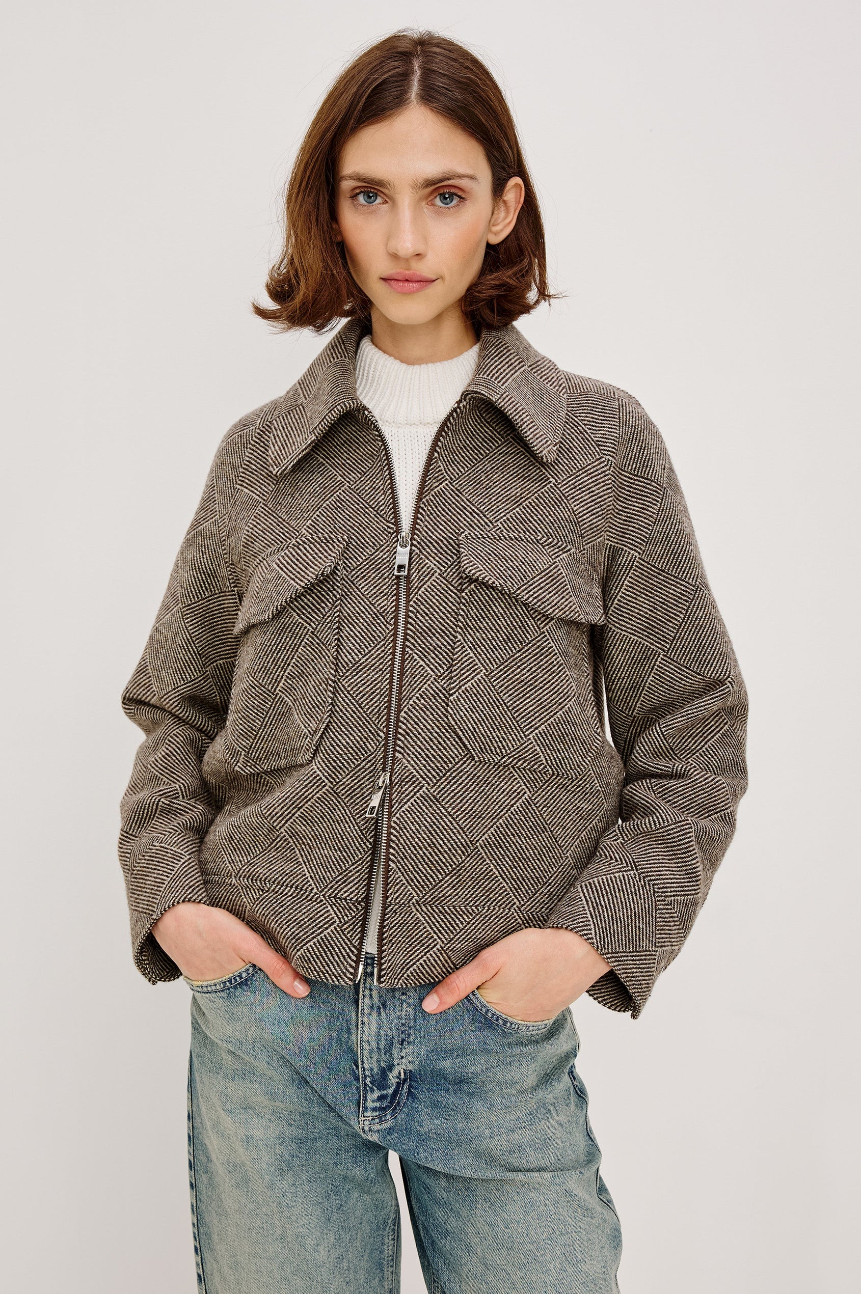 Truckee, a heavyweight wool-blend aviation-style jacket with a textured basketweave pattern. The jacket is fully lined and features oversized flap chest pockets and a two-way front zipper. Front View featured on model, Zipped Up