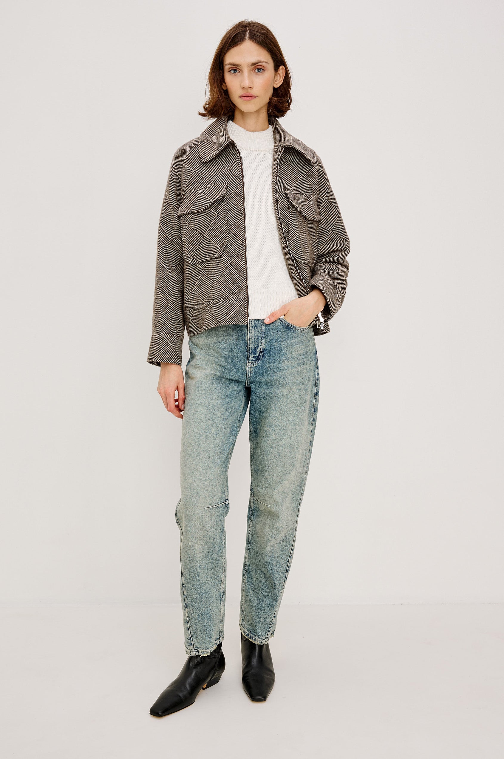 Truckee, a heavyweight wool-blend aviation-style jacket with a textured basketweave pattern. The jacket is fully lined and features oversized flap chest pockets and a two-way front zipper. Full Body Front View featured on model, Unzipped