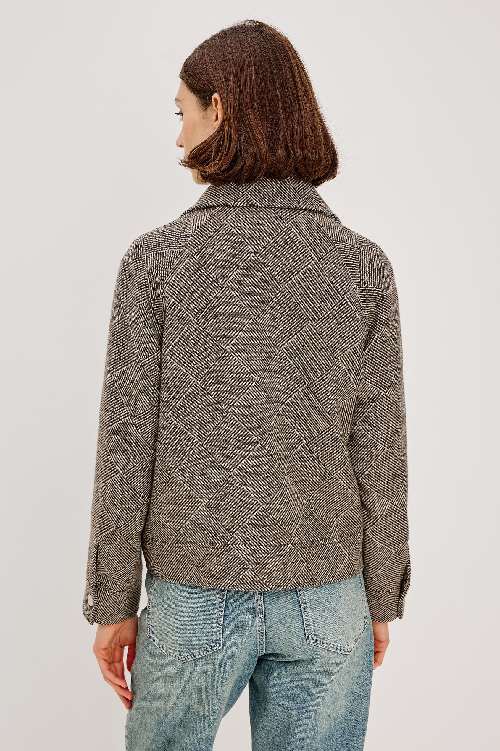 Truckee, a heavyweight wool-blend aviation-style jacket with a textured basketweave pattern. The jacket is fully lined and features oversized flap chest pockets and a two-way front zipper. Back View featured on model, Zipped Up