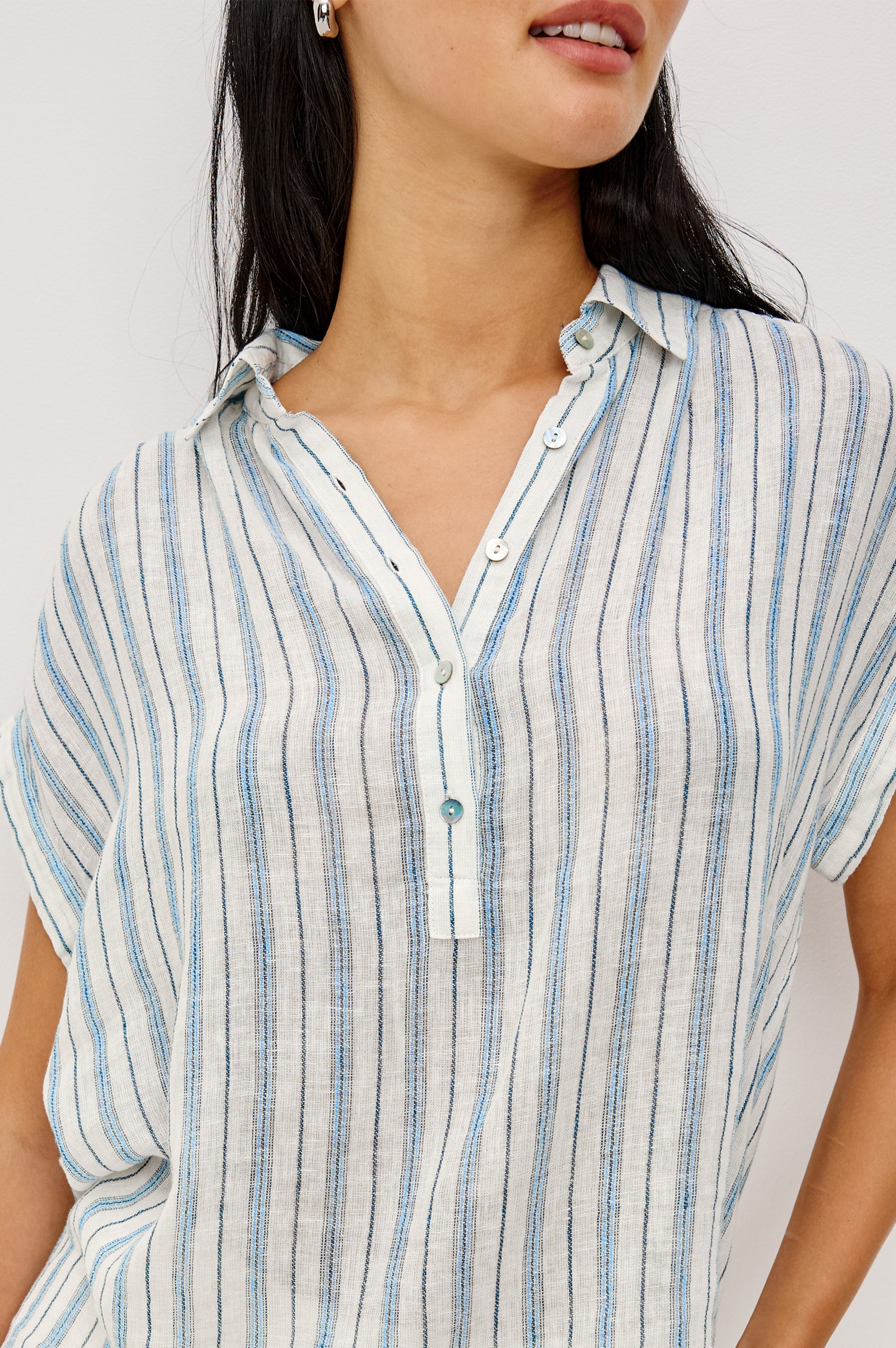 Tuscany Shirt in Linen With Collar, Front Half Placket, Capped Cuff Sleeves, and Relaxed Fit in Windward Stripe Colorway - Upper Body Front View Featured on Model