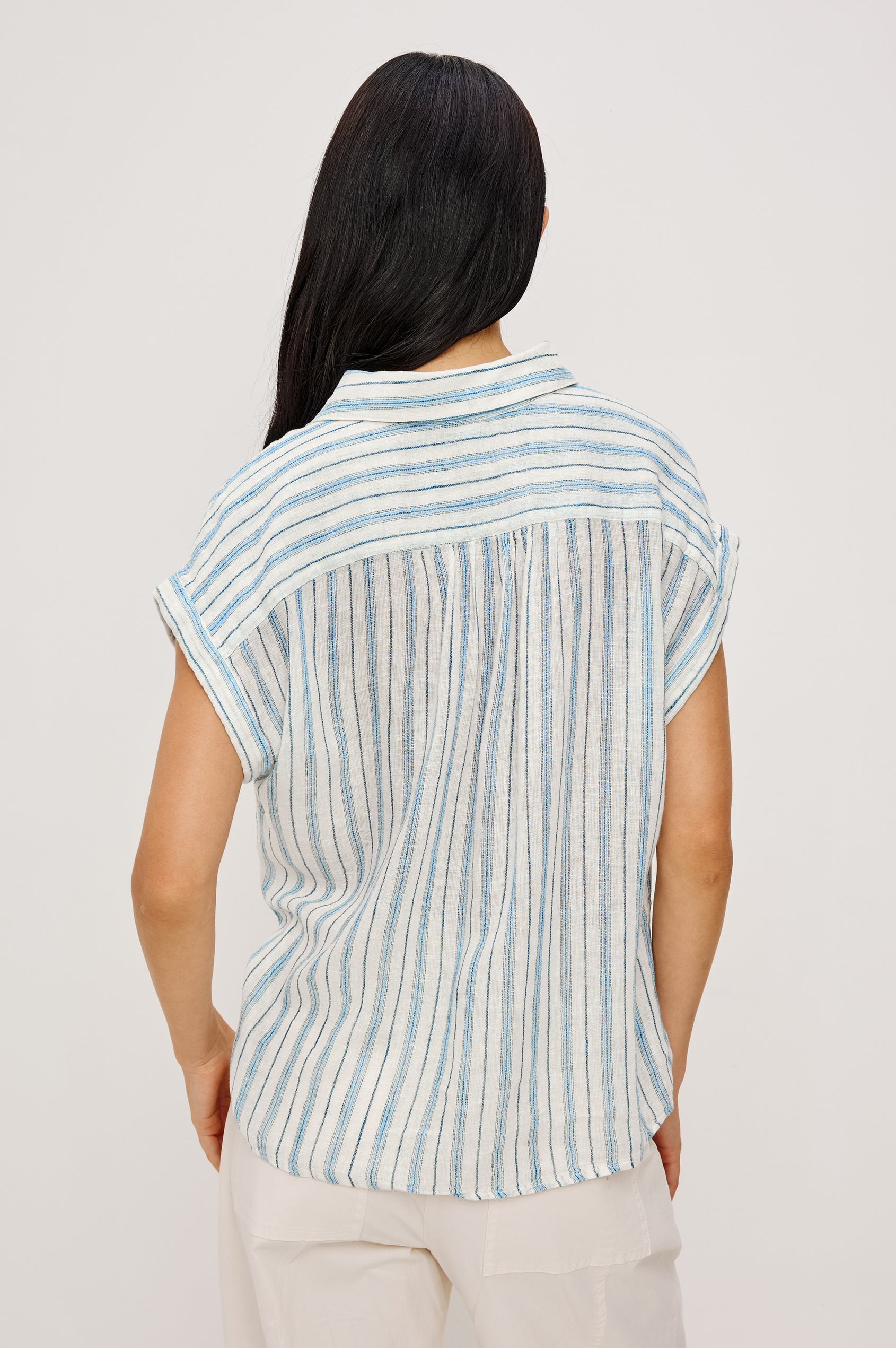 Tuscany Shirt in Linen With Collar, Front Half Placket, Capped Cuff Sleeves, and Relaxed Fit in Windward Stripe Colorway - Upper Body Back View Featured on Model