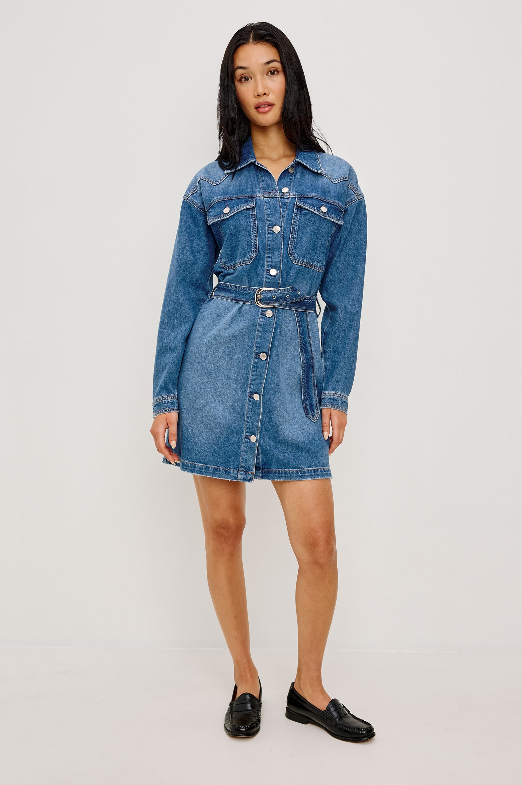 Tustin Mini Shirt Dress in Rigid Denim With Western Yoke, Front Buttons, Self Belt, Dropped Shoulders, and Long Sleeves in Skyride Colorway - Full Body Front View Featured on Model