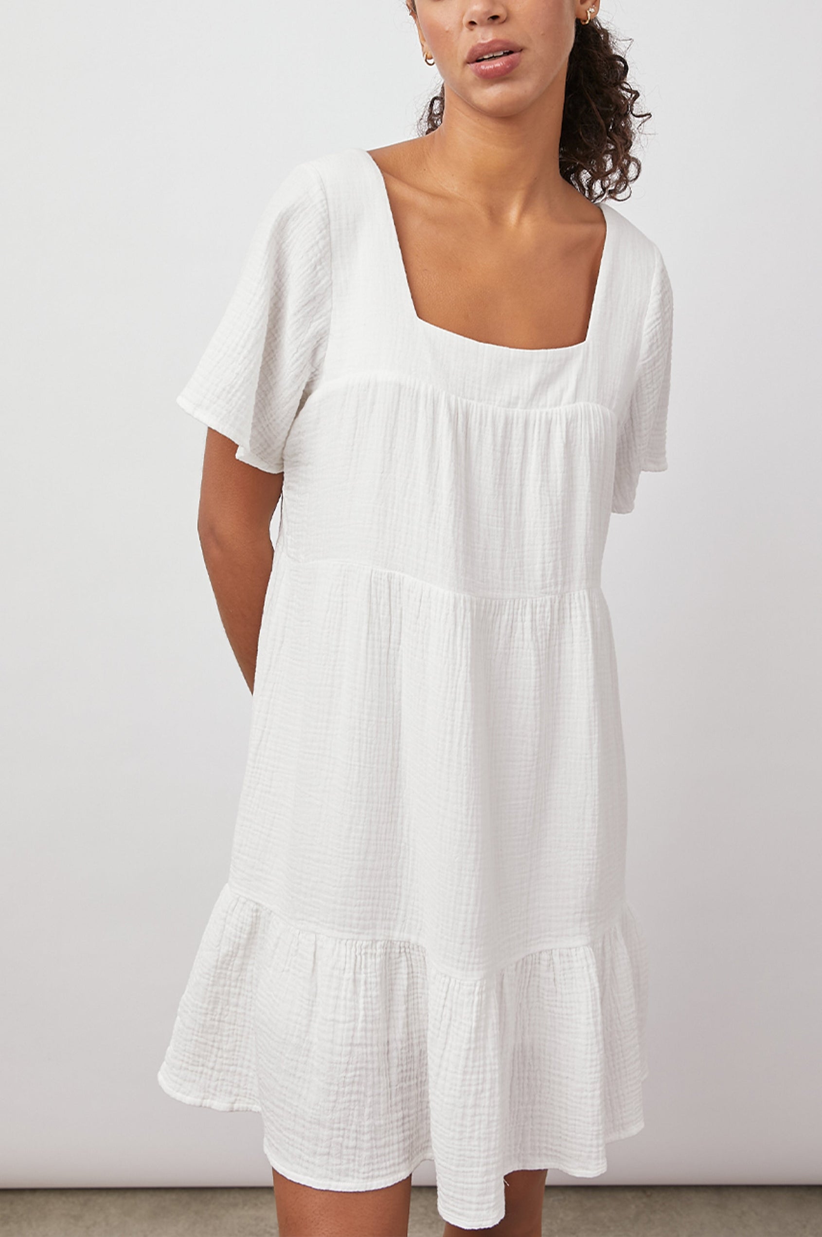 Valentina Short-Sleeve Tiered Mini Dress with a Square Neckline in White Colorway - Front View Featured on Model 