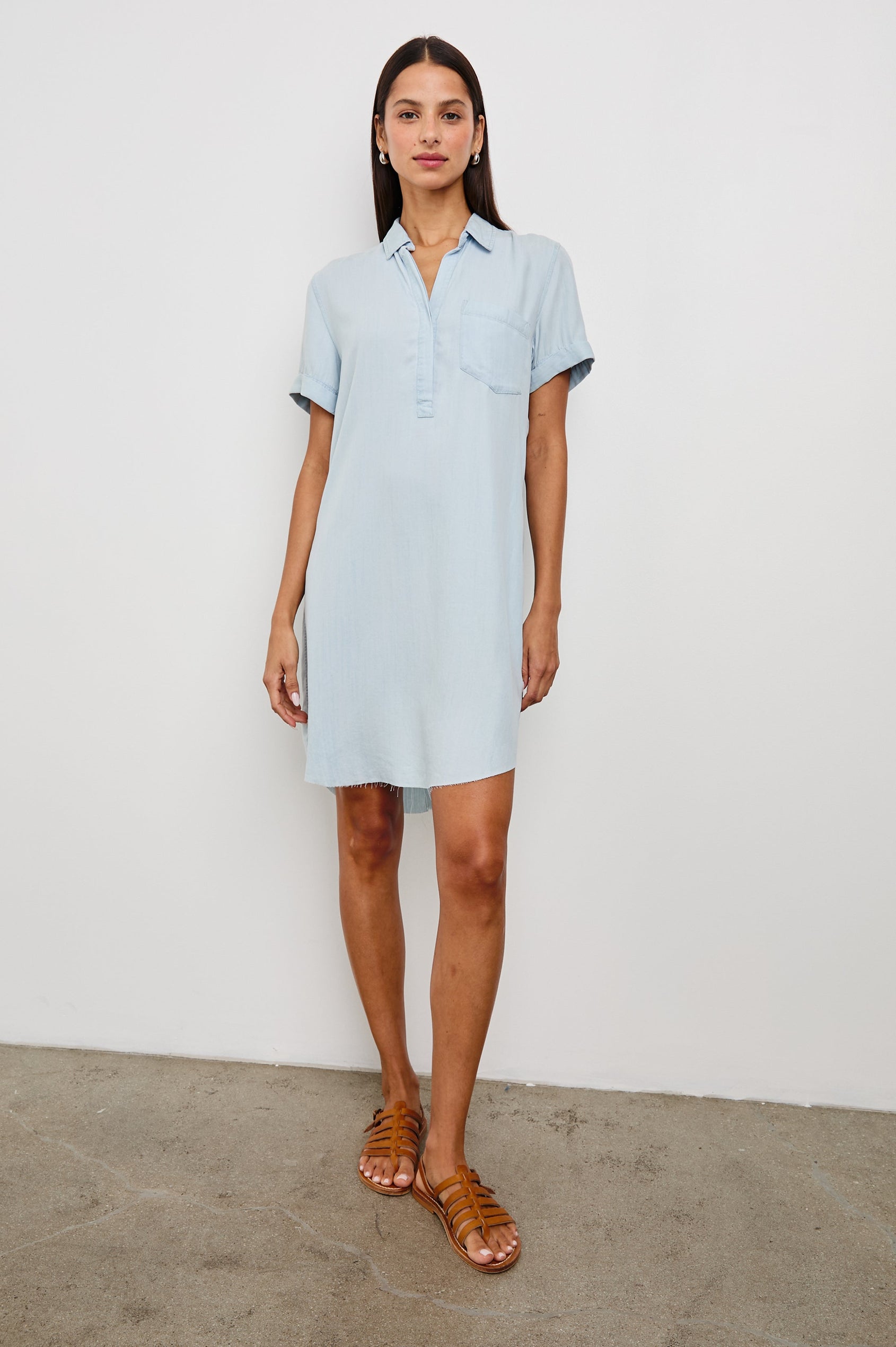 Valerie Short-Sleeve Denim Mini Dress with Rolled Cuffs, a Collar, a Half Sealed Placket, a Chest Pocket and a Raw Hem in Light Vintage Colorway - Front Full Body View Featured on Model 