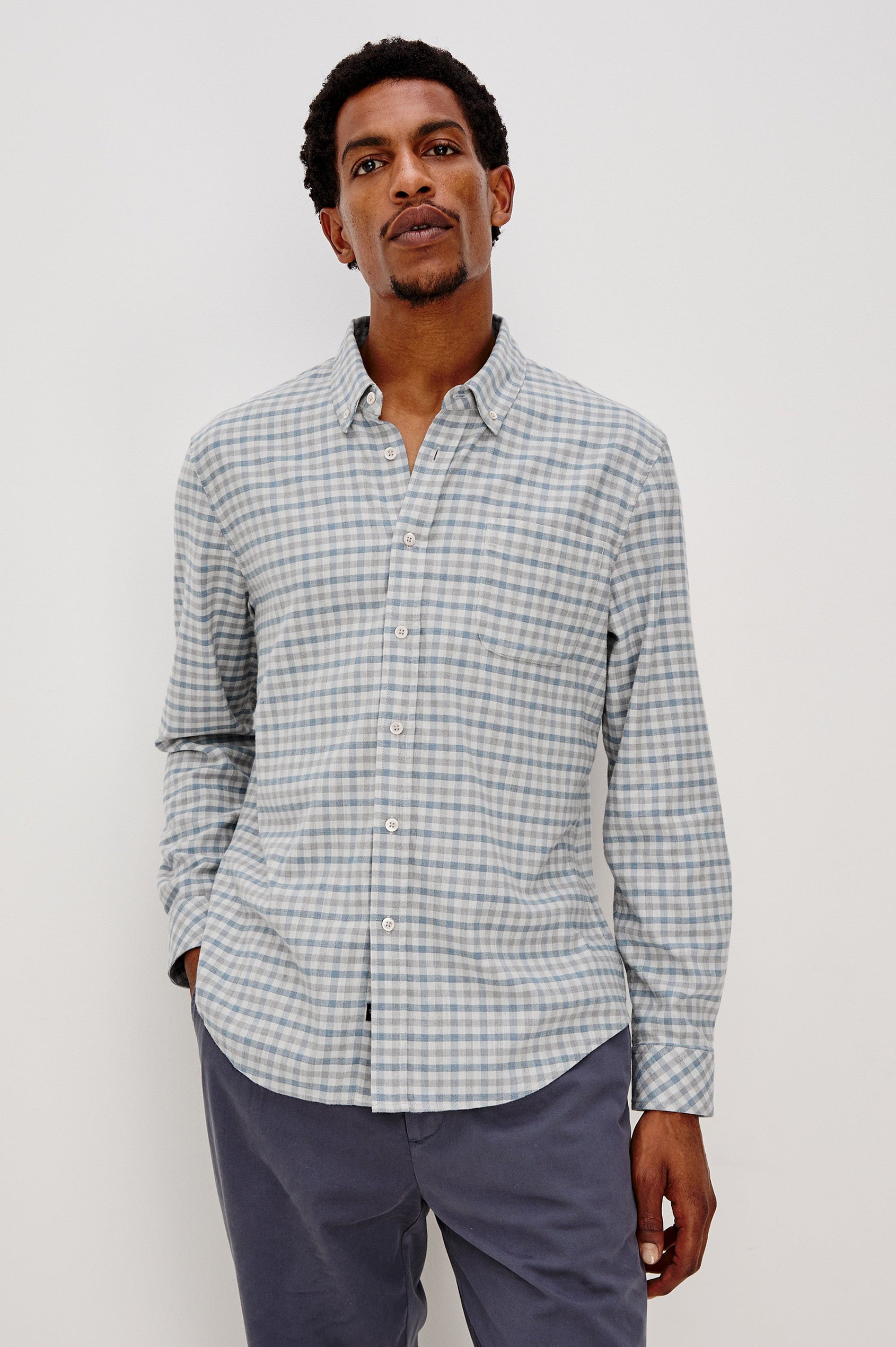 Vance button front collared shirt with long sleeves, collard stand buttons and a single chest pocket in Charcoal Blue Check colorway. Front view shown on model.