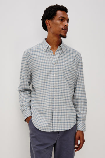 Vance button front collared shirt with long sleeves, collard stand buttons and a single chest pocket in Charcoal Blue Check colorway. Front view shown on model.