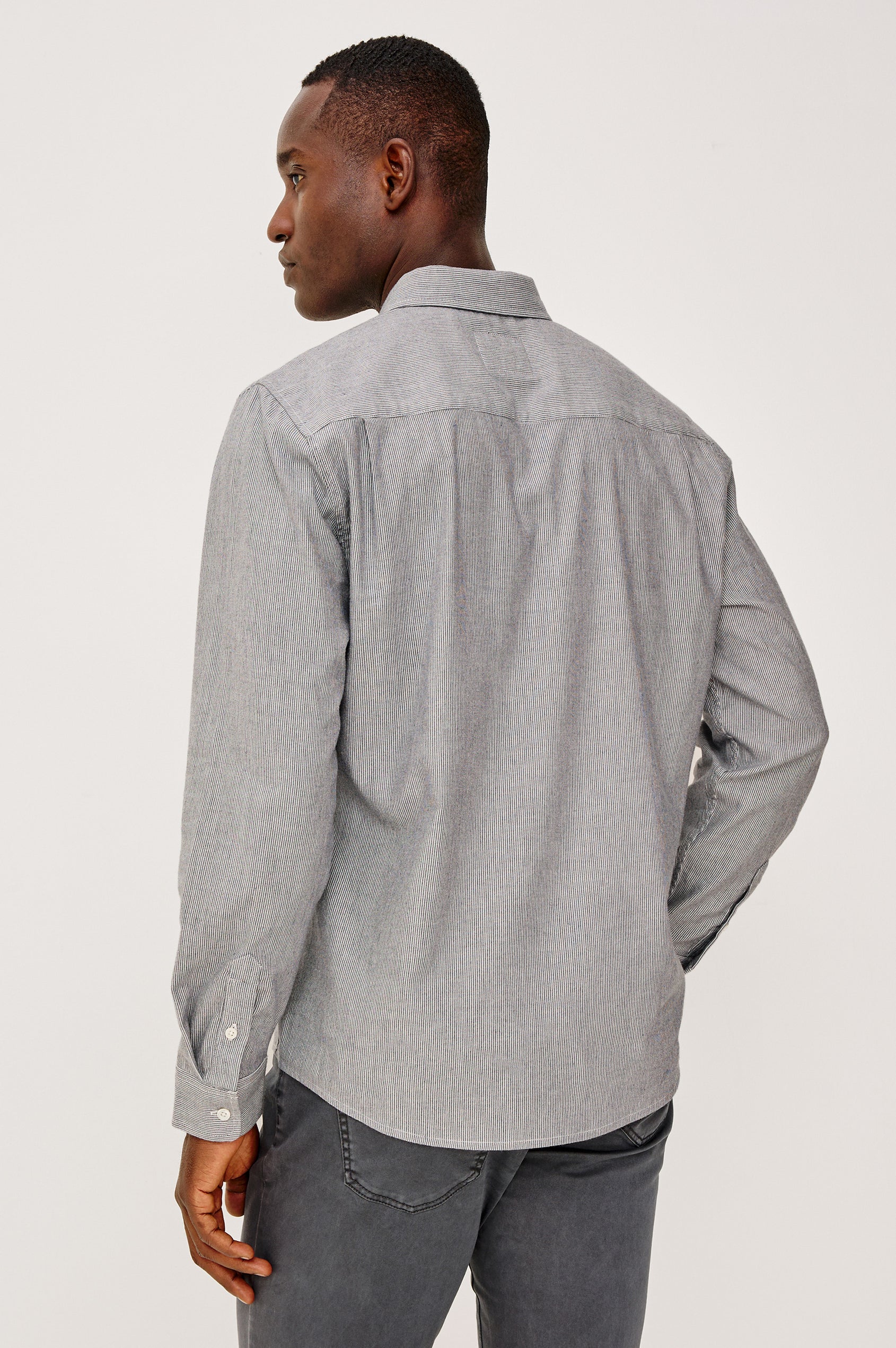 Vance Button Front Collared Shirt With Long Sleeves and Single Chest Pocket in Navy Rope Stripe Colorway - Upper Body Back View Featured on Model