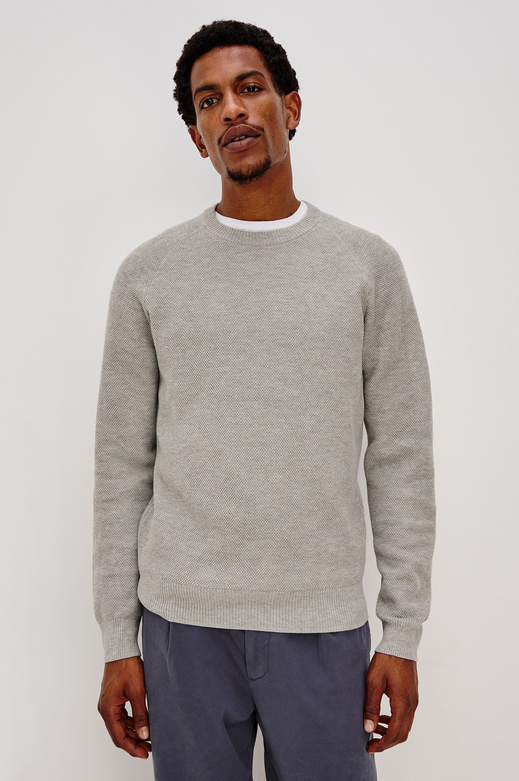 Vann long sleeve crew neck sweater in Grey Heather Colorway. Front View on Model Shown.