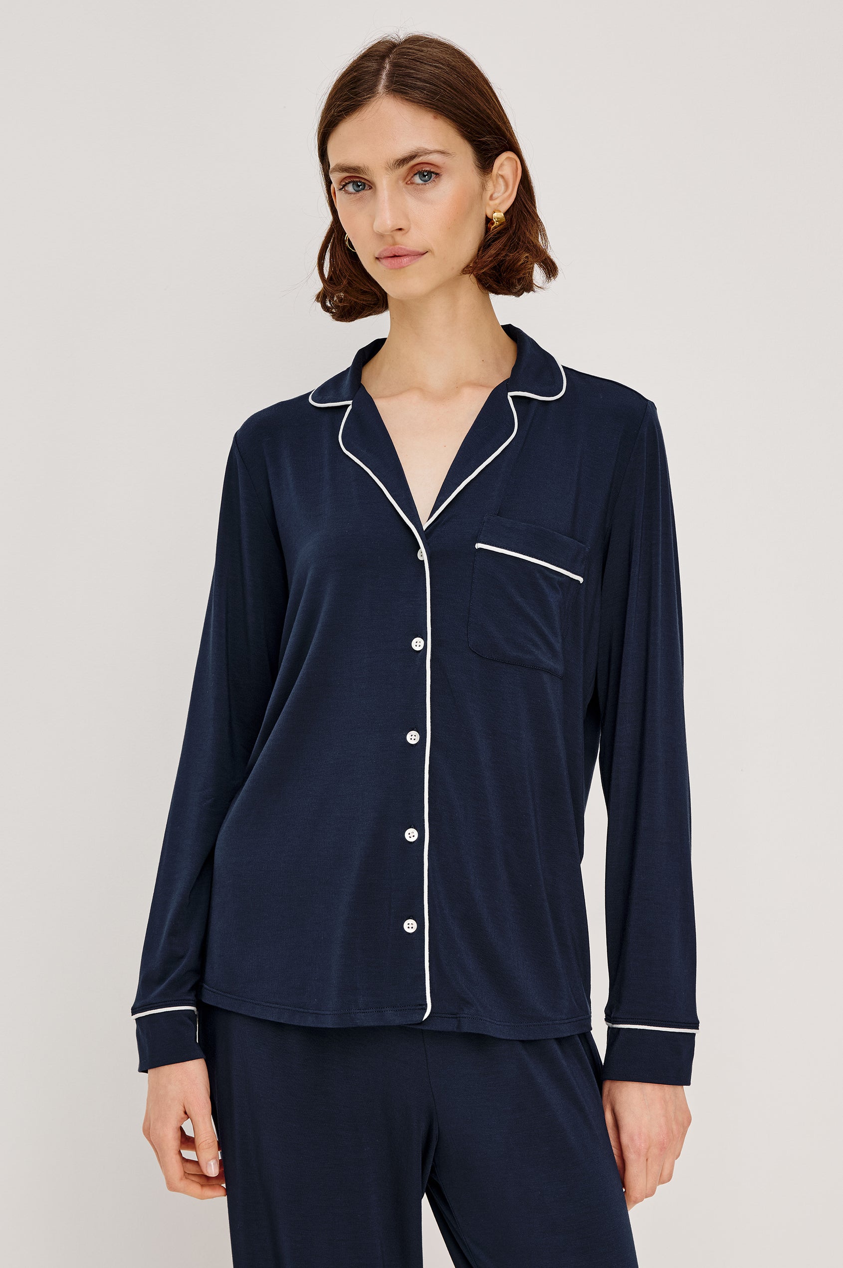 Varra Pajama Set in Jersey With Contrast Piping Button-Up Shirt With Notched Collar and Long Sleeves and Matching High-Waisted Pants With Adjustable Waist Drawstring Ties in Loose Fit in Navy Colorway - Upper Body Front View Featured on Model