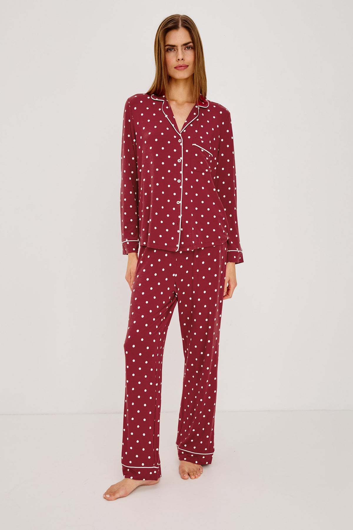 Varra Pajama Set in Soft Jersey With Contrast Piping, Relaxed Fit, Long Sleeve Collared Button-Up Shirt, and Straight-Leg Pants in Cardinal Polka Colorway - Full Body Front View Featured on Model