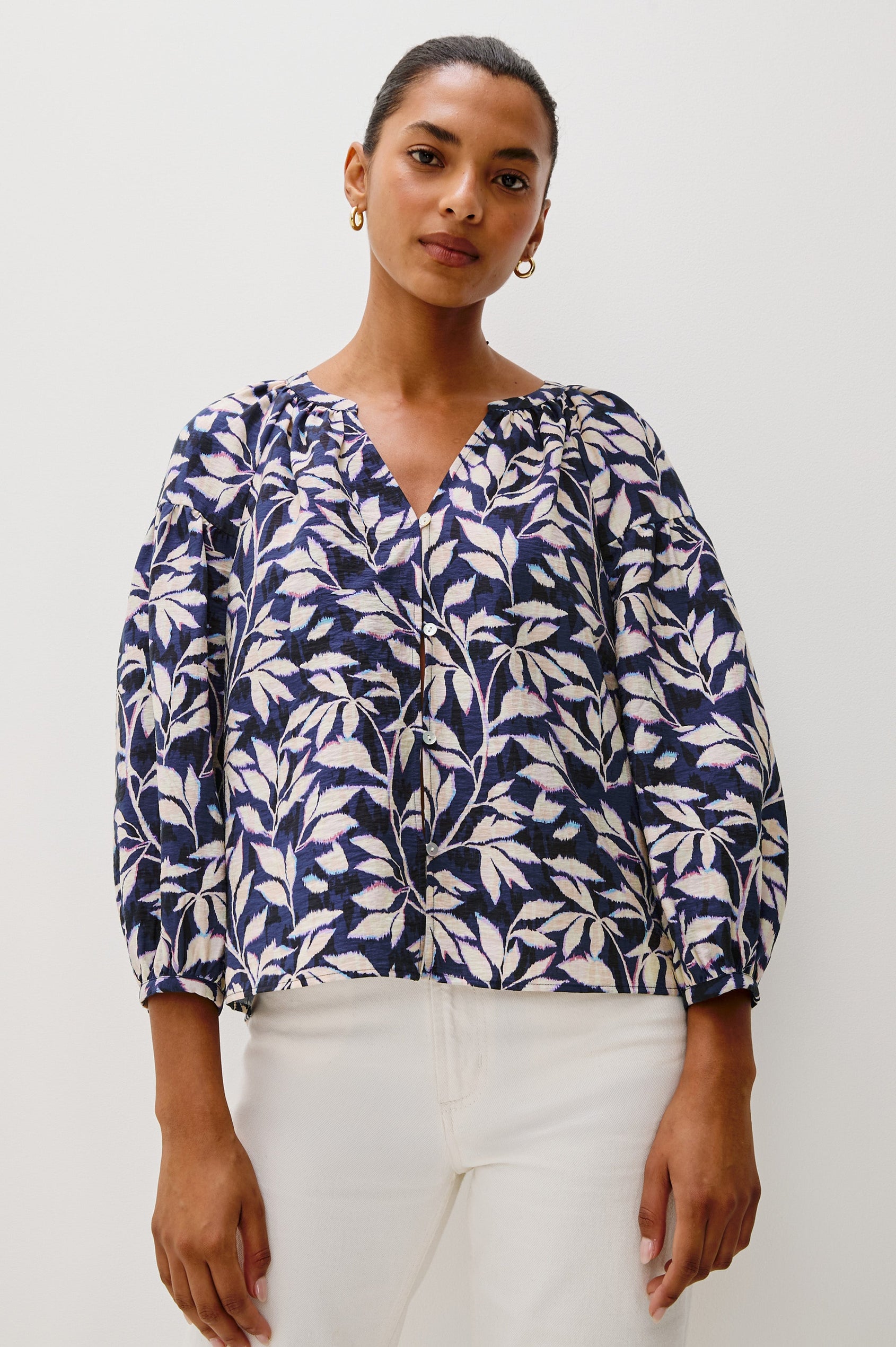 Vasia loose fitted long sleeve top with front button closure and raglan sleeves in Navy Vines print - front view featured on model, untucked