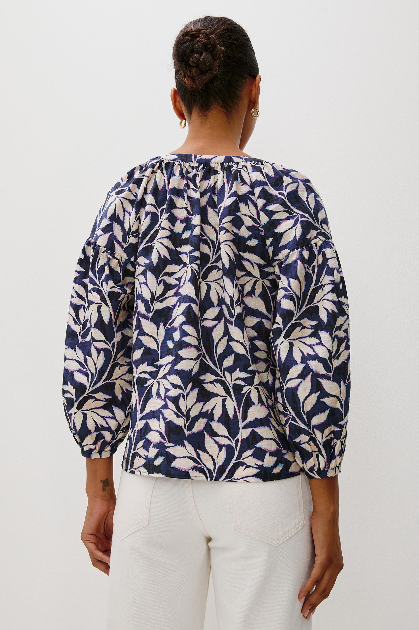 Vasia loose fitted long sleeve top with front button closure and raglan sleeves in Navy Vines print - back view on model