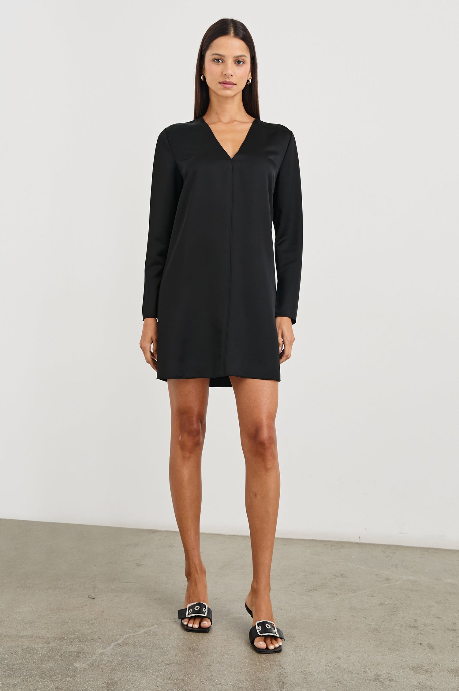Victoria Long-Sleeve Mini Dress with a V Neck, and Front and Back Center Vertical Seams in Black Colorway - Front Full Body View Featured on Model 