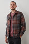 Viggo Long-Sleeve Shirt Jacket with Button Closure and Two Button Chest Flap Pockets in Crimson Shadow Plaid Colorway - Front Unbuttoned View Featured on Model