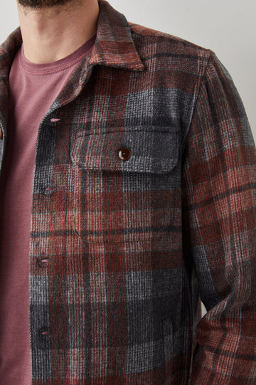 Viggo Long-Sleeve Shirt Jacket with Button Closure and Two Button Chest Flap Pockets in Crimson Shadow Plaid Colorway - Front Unbuttoned View Featured on Model