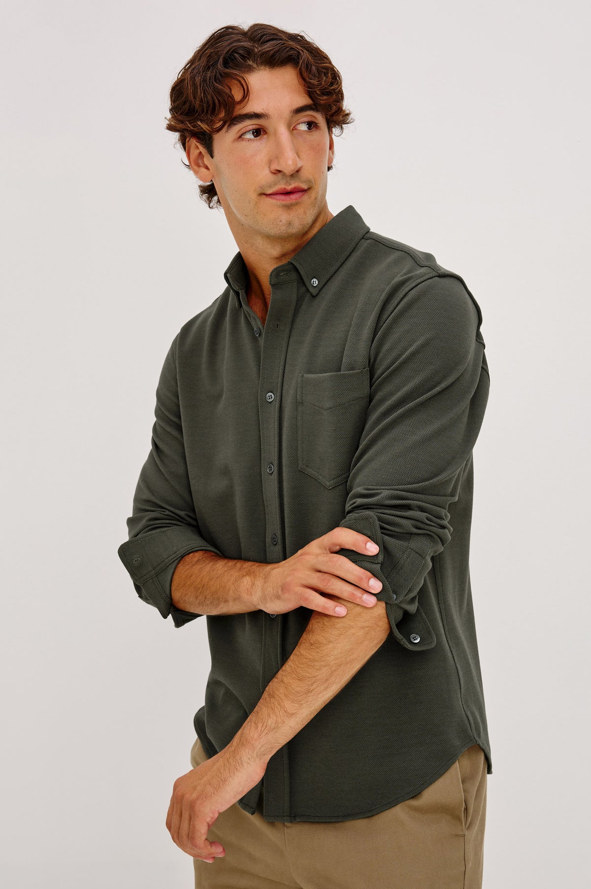 Vincent is a Collared Long Sleeve Button Front Shirt with a Chest Pocket in Hunter Green Colorway - Front View Featured on Model.