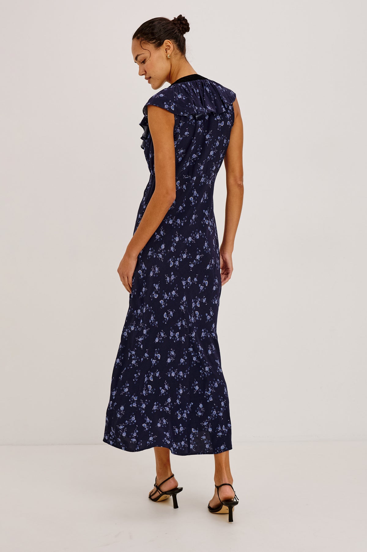 Virginia Maxi Dress in Lightweight Crepe With Ruffle-Trimmed Plunging V-Neckline With Center-Front Bow, Bias Cut, Side Zip Closure, and Godet Insets in Navy Romantic Floral Colorway - Upper Body Back View Featured on Model.