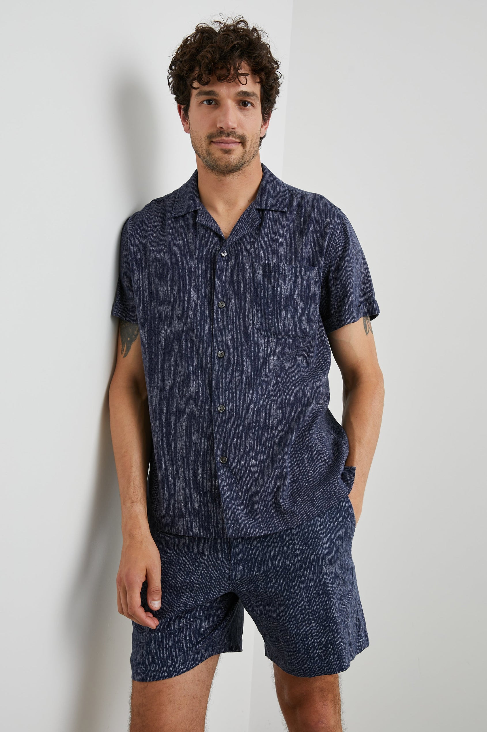 Waimea Short-Sleeve Button Up with a Chest Patch Pocket in Matrix Navy Pearl Colorway, with thin pearl vertical dashes on navy - Front View Featured on Model