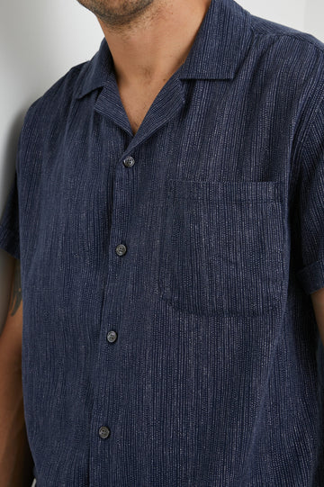 Waimea Short-Sleeve Button Up with a Chest Patch Pocket in Matrix Navy Pearl Colorway, with thin pearl vertical dashes on navy - Front View Featured on Model