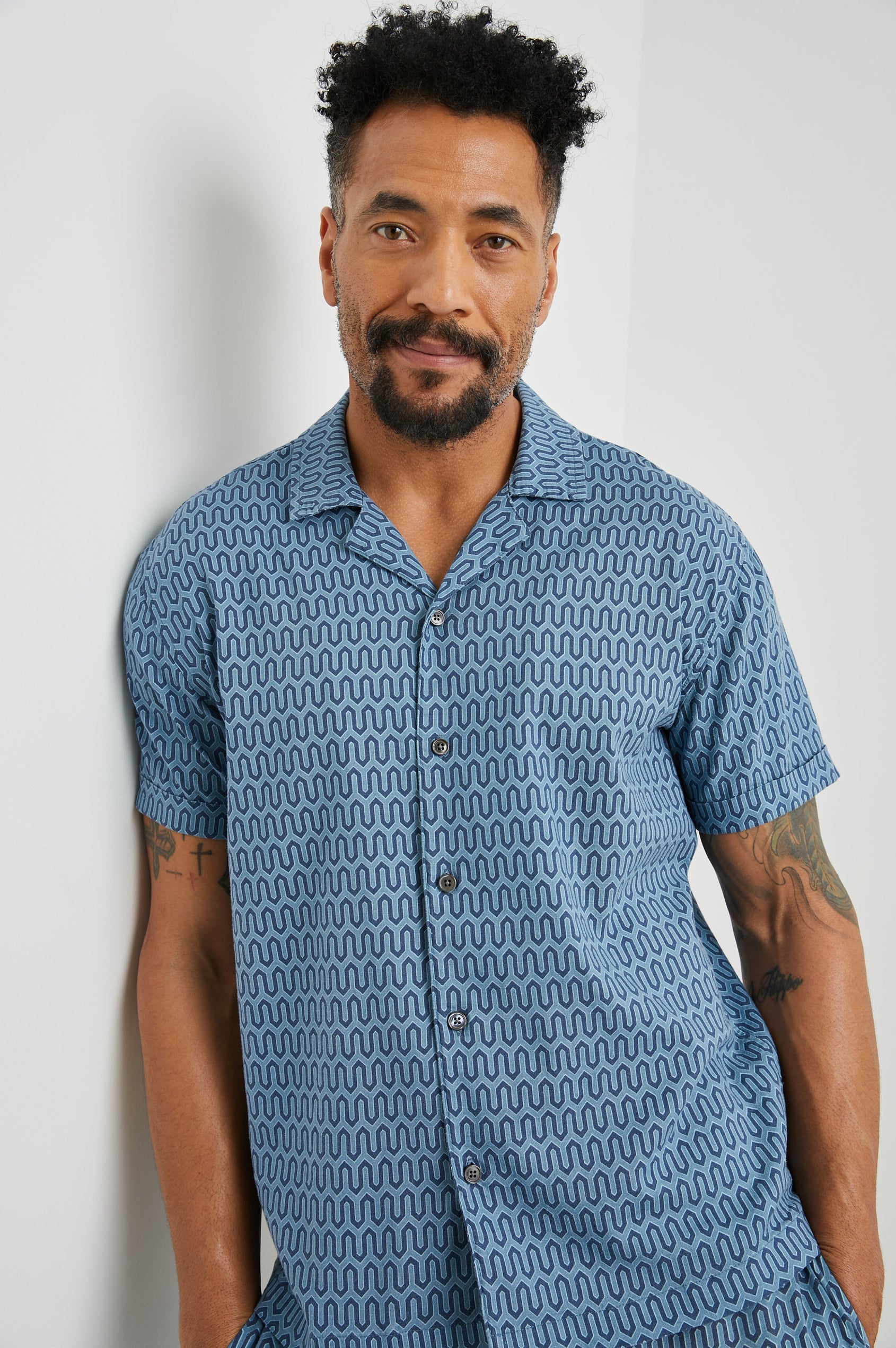 Waimea Short-Sleeve Button Up with a Chest Patch Pocket in Wishbone Blues Colorway, a dark and light blue geometric pattern - Front View Featured on Model
